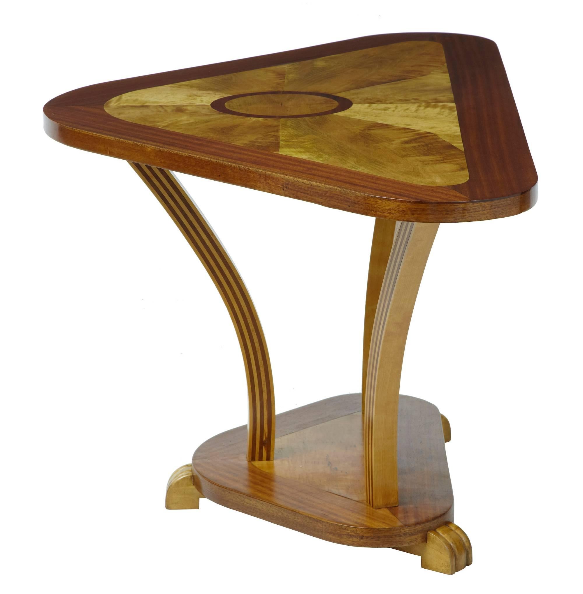 Unusual inlaid shaped console table circa 1920.
Using contrasting mahogany and birch veneers, this table is rich in Art Deco design.
Multi layered shaped legs.

Measure: Height 25 3/4