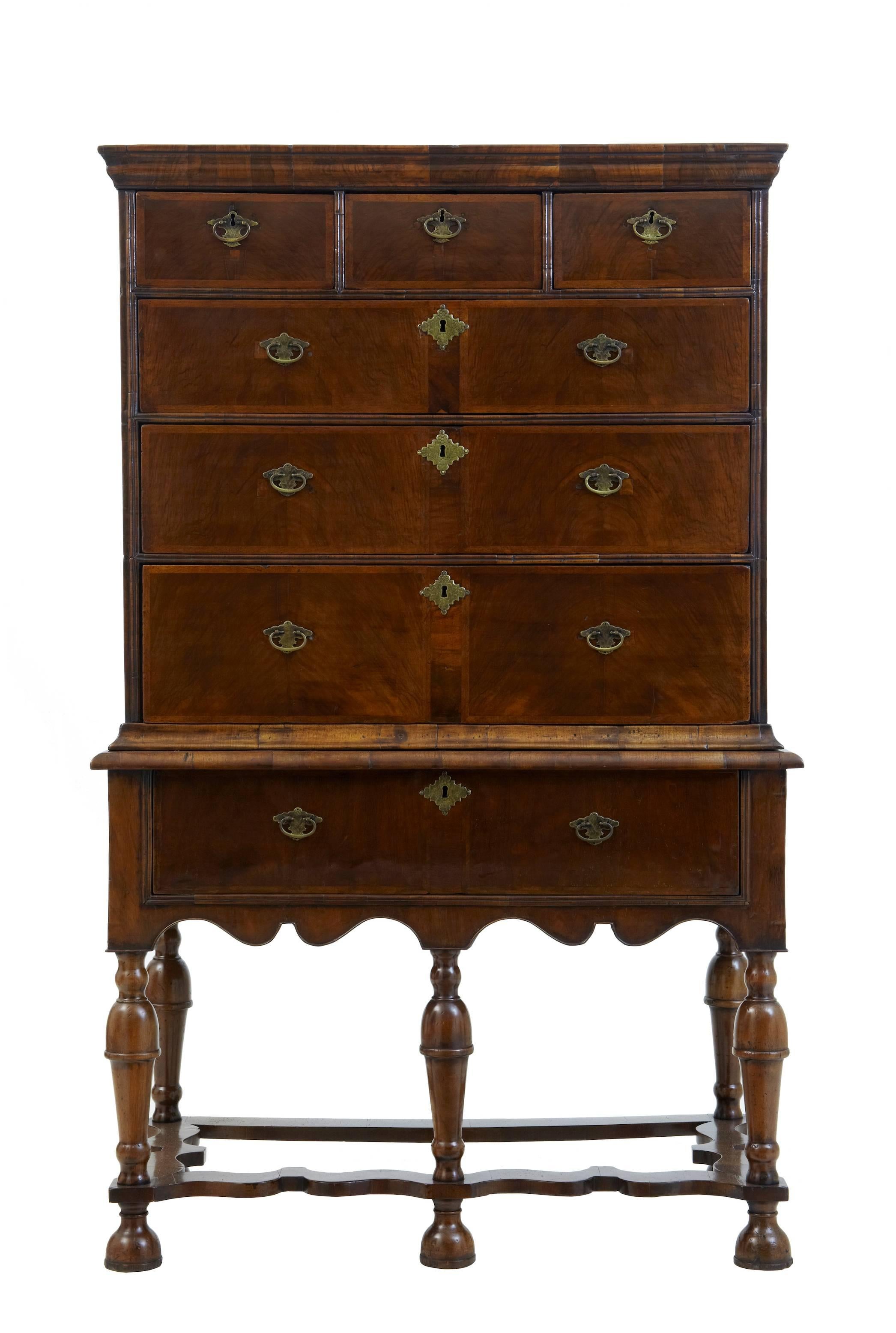 Superb restored chest on stand, circa 1700.
Consisting of two parts.
Top section with three short over three long drawers, crossbanded edges, later handles but original escutcheons.
Base with single drawer, standing on six turned legs united by