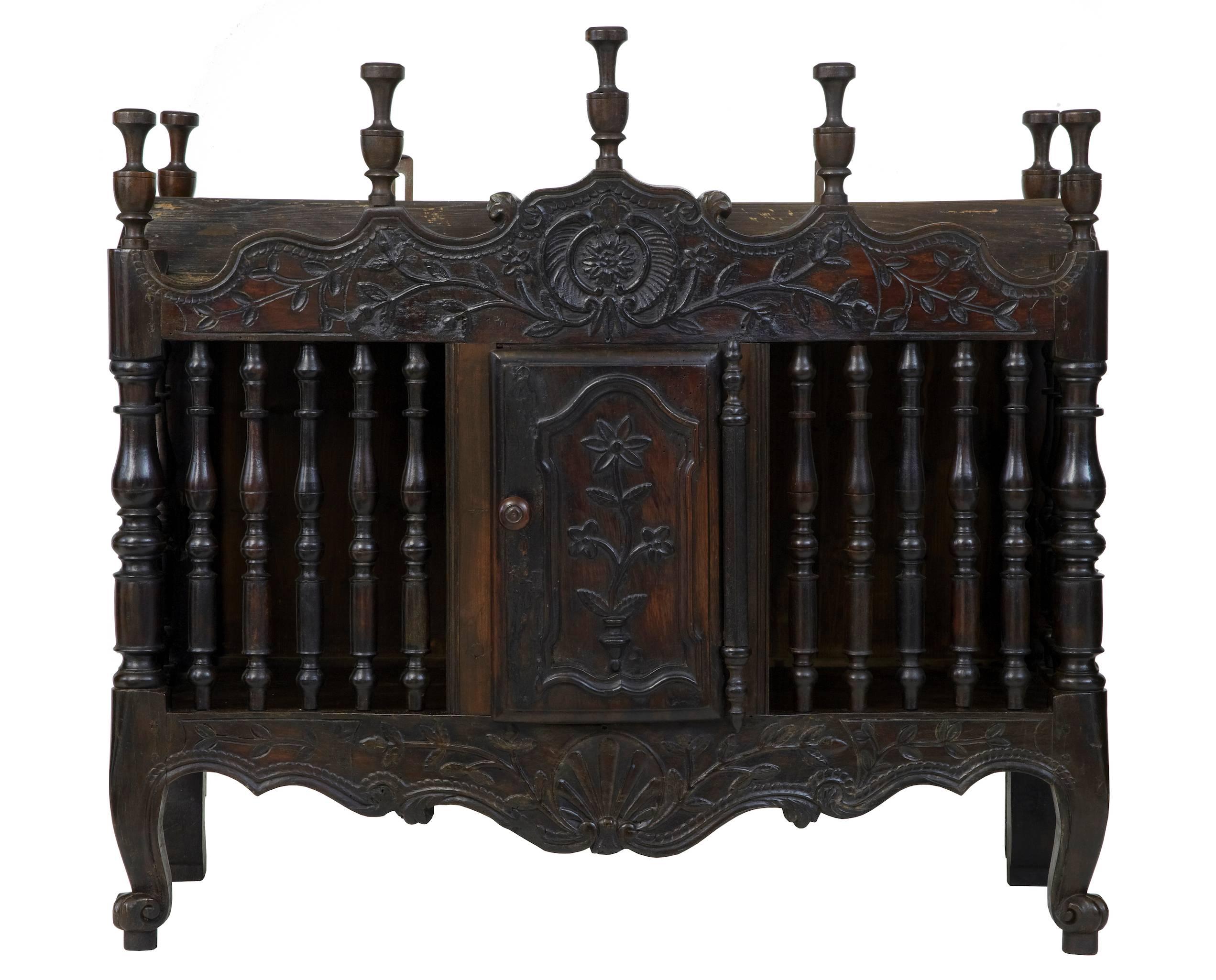 Fine French walnut panetiere, circa 1820.
Typical beautifully carved door and frieze, with spindles.
Dark rich color.
Later base board.
Evidence of old inactive worm.

Measures: Height: 34 1/4