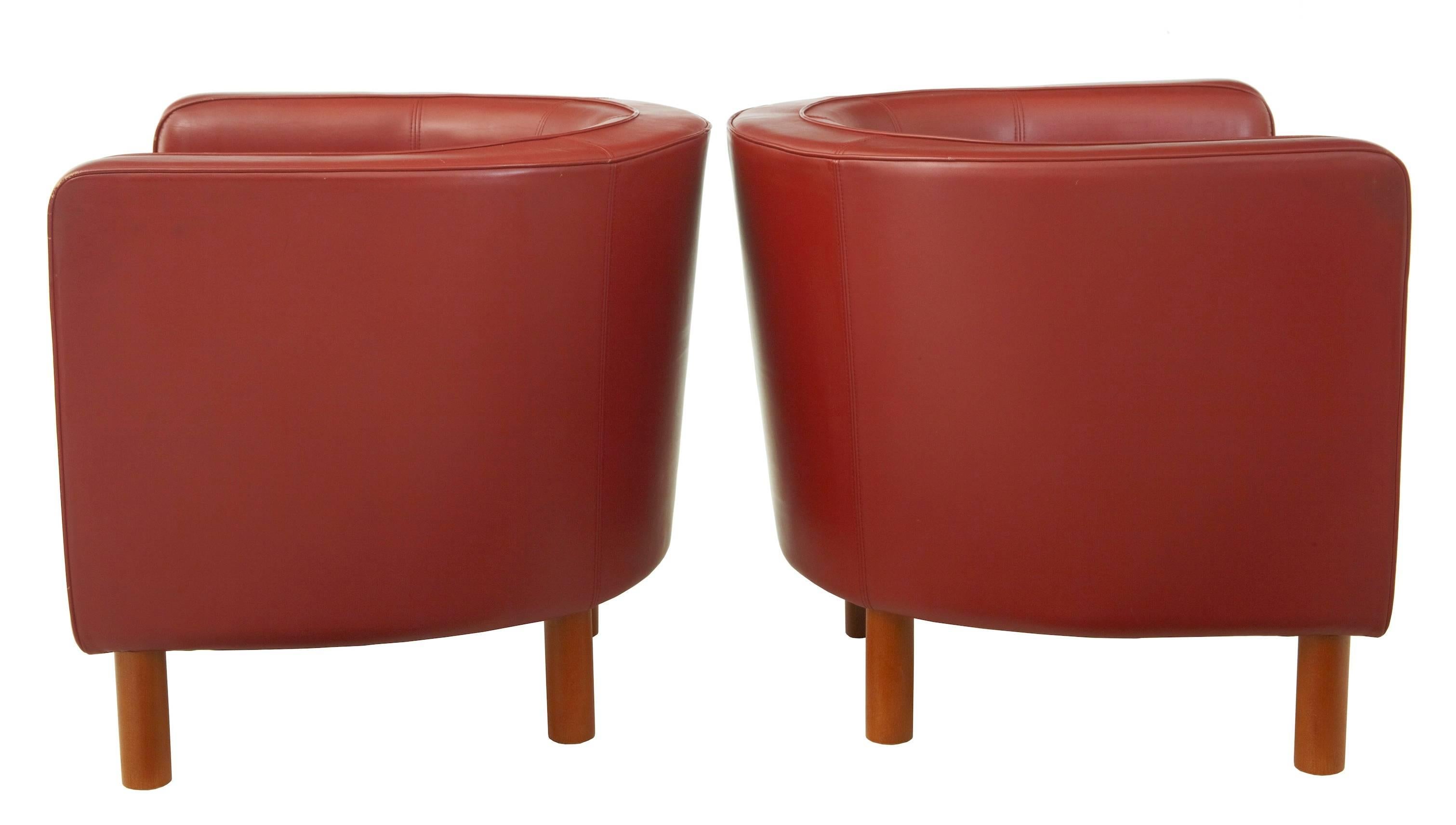 Fine quality leather lounge club armchairs in the Art Deco taste.
Upholstered in rusty red leather.
Beech round legs and exposed front under frame
Very comfortable and stylish.

Some minor wear to leather piping. Minor scuff marks

Measures: