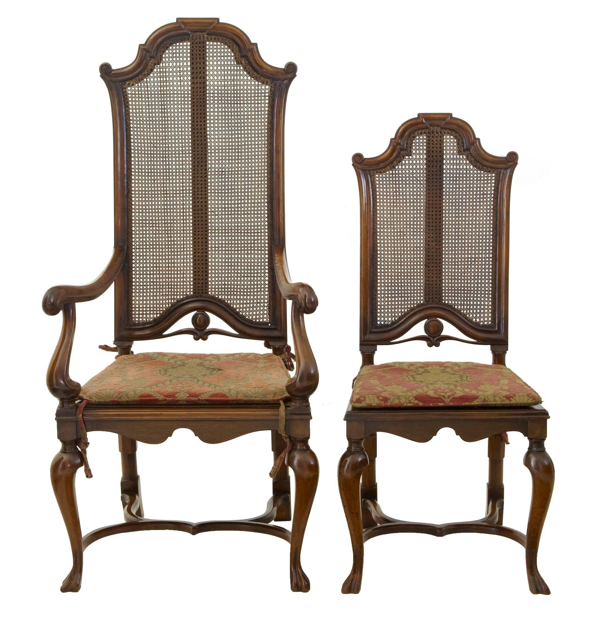 Superb quality set of William and Mary style walnut dining chairs, circa 1895.

Set comprises of two armchairs and six singles.
Beautifully carved all-over, with shaped arms, legs and stretchers.
Cane backs are all in good order, cane work to