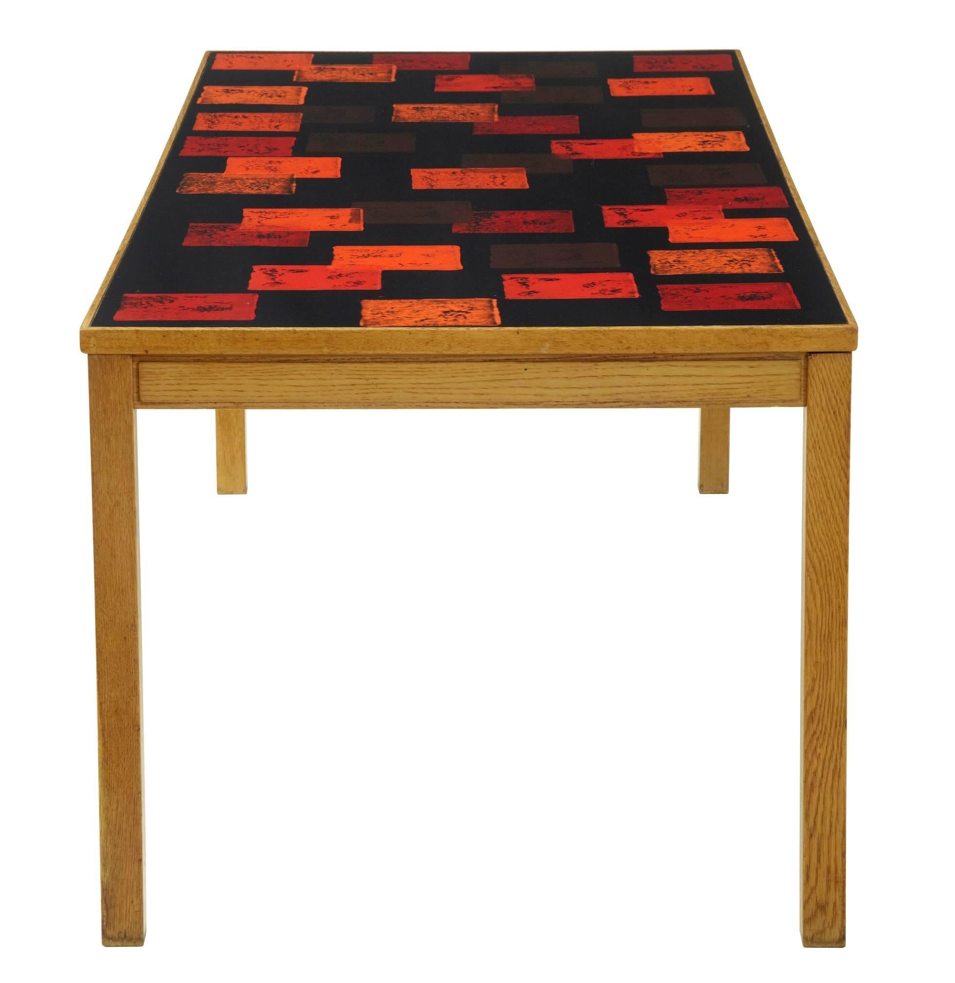 Collectable table by David Rosen, circa 1963.
Enamel top signed by the creator p torneman.
Makers label underneath with date stamp.
Wood work would benefit a strip and repolish to restore to former glory, enamel top is in good order with minor