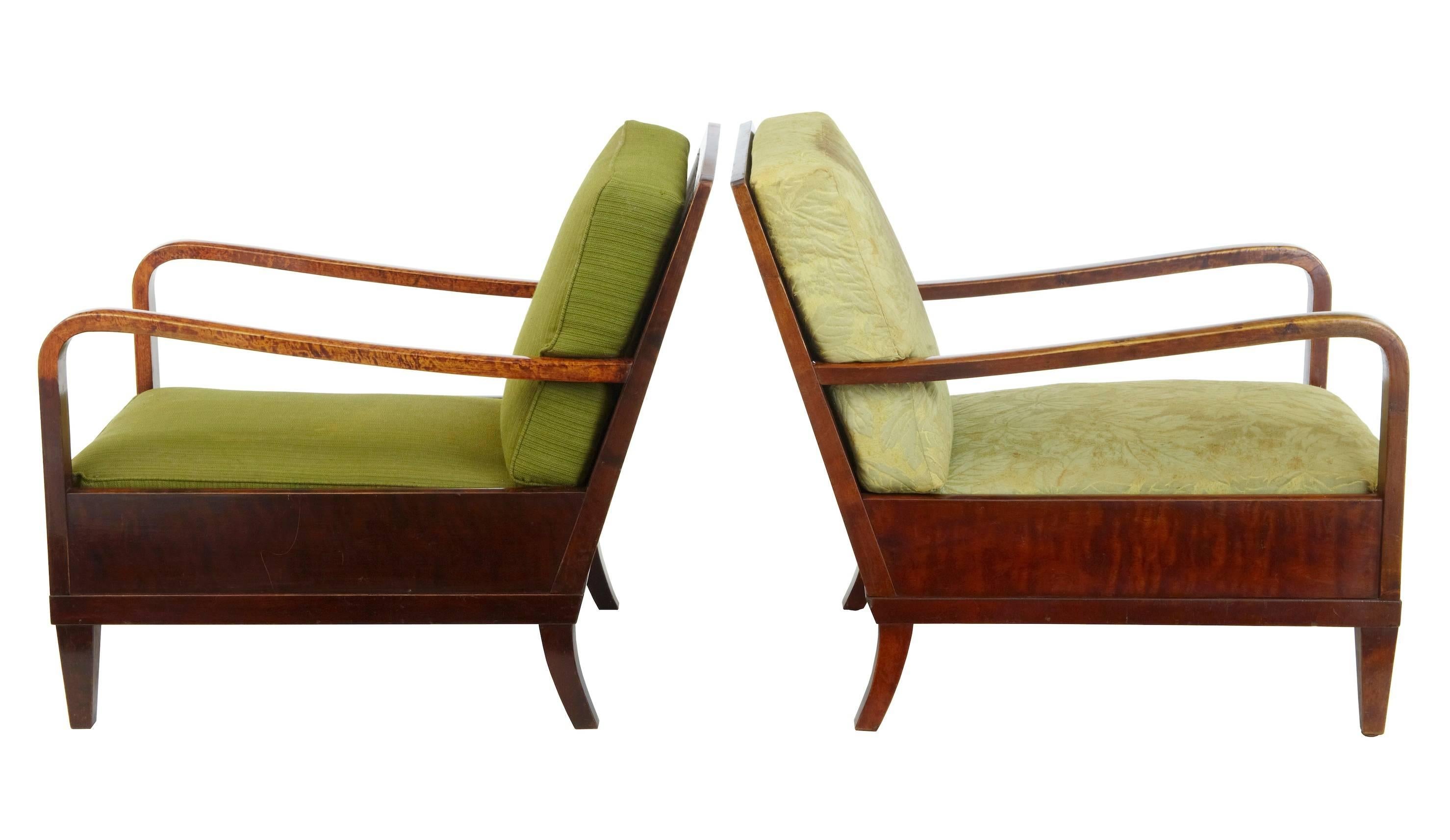 Here we have a fine pair of pure Art Deco lounge chairs, circa 1920.
Ready to be recovered to bring back to former glory.
Beautifully inlaid down the arm.
One in original cover, other in later covering.
Minor marks and repairs to