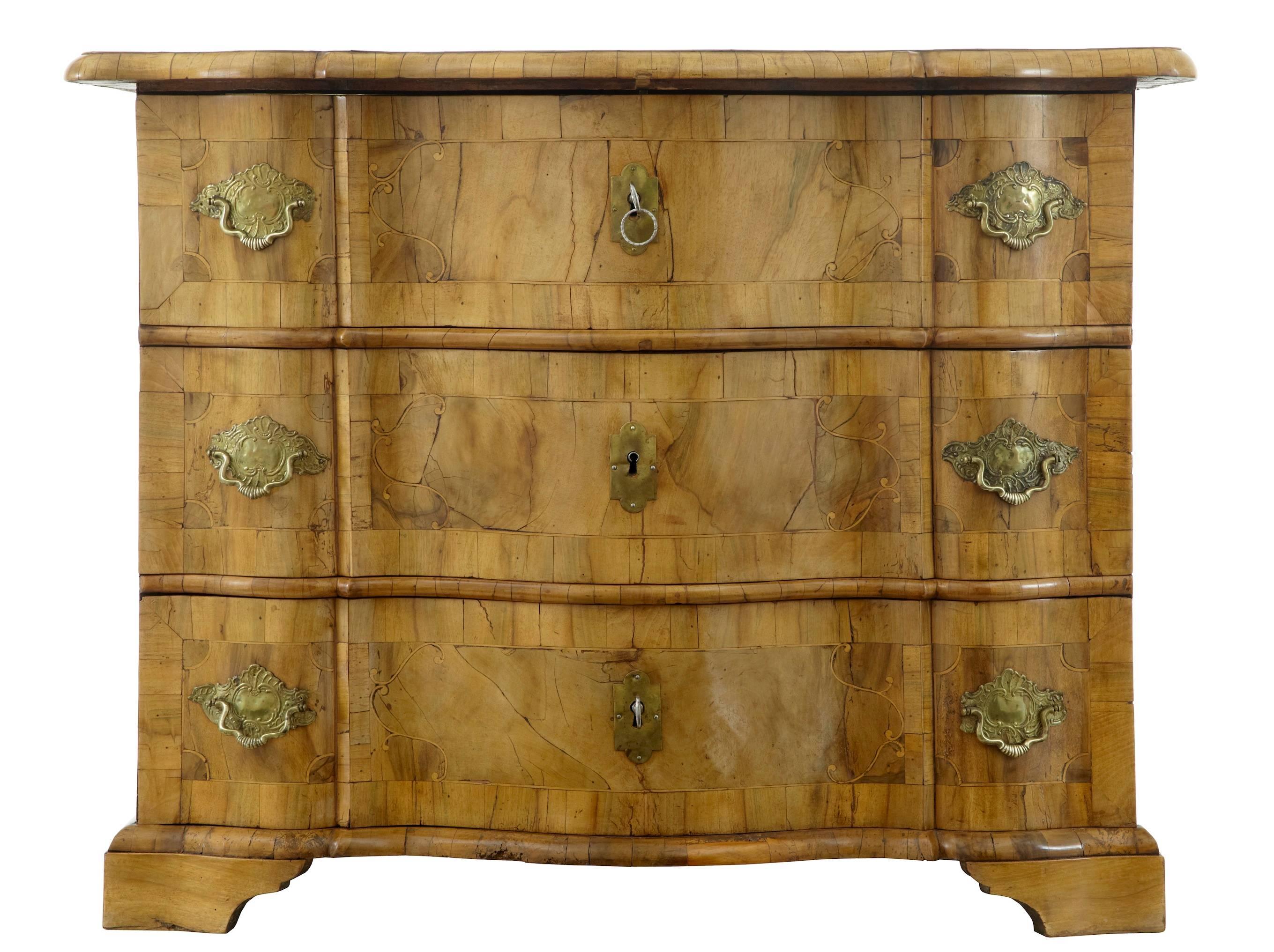Fine quality Swedish commode, circa 1730.
Beautiful natural color on this commode which has taken nearly 300 years to develop.
Serpentine oversailing top.
Three-drawer chest with inlaid front. The top has a inlaid hunting scene.

Replaced back