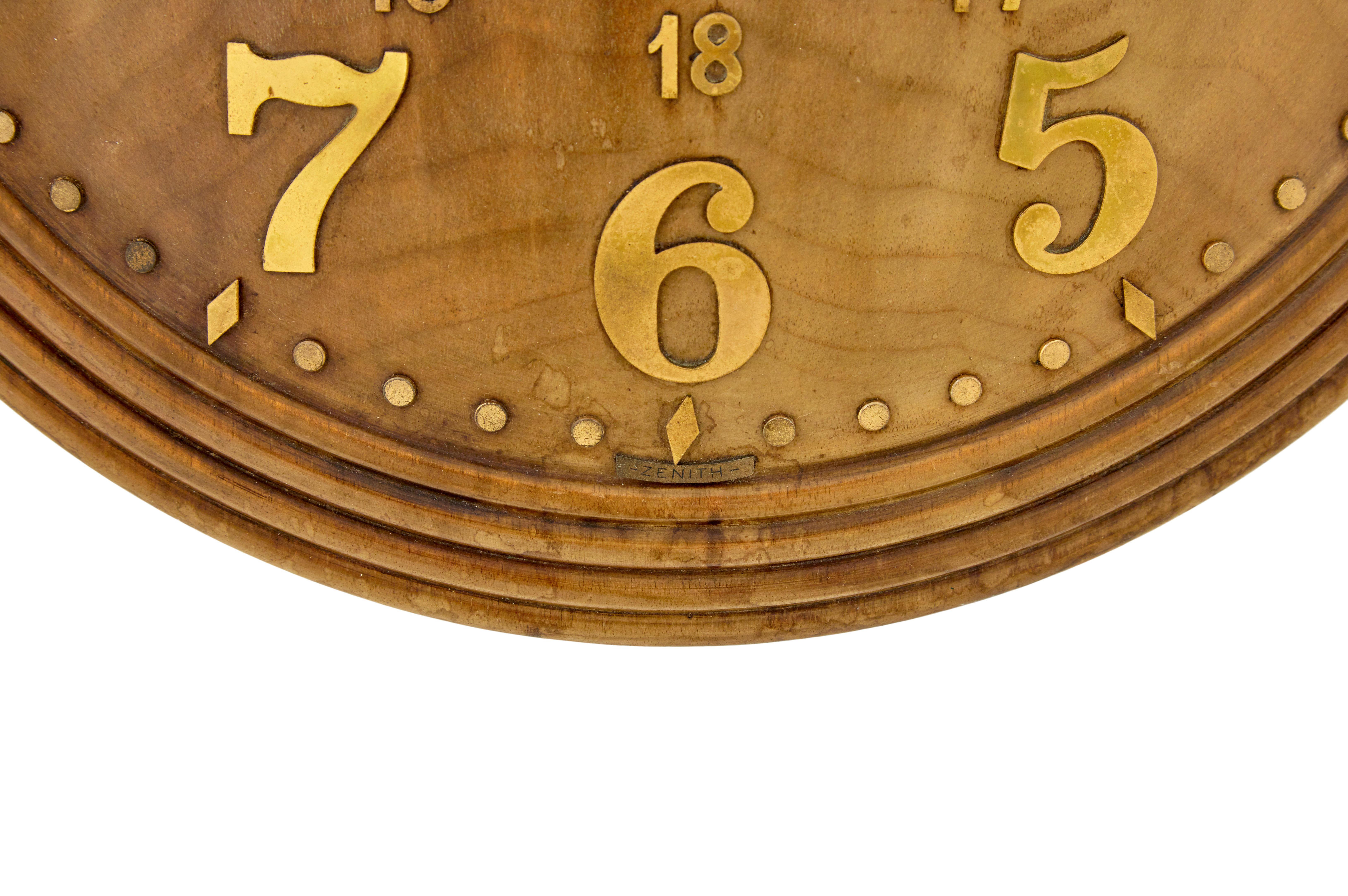 Art deco shaped wall clock by zenith circa 1930.

Well known art deco swiss made wall clock retailed by heal’s in the 1930’s. Convex shaped round clock face with moulded edge. Decorated with applied brass numerals and hands.

Fitted with a swiss