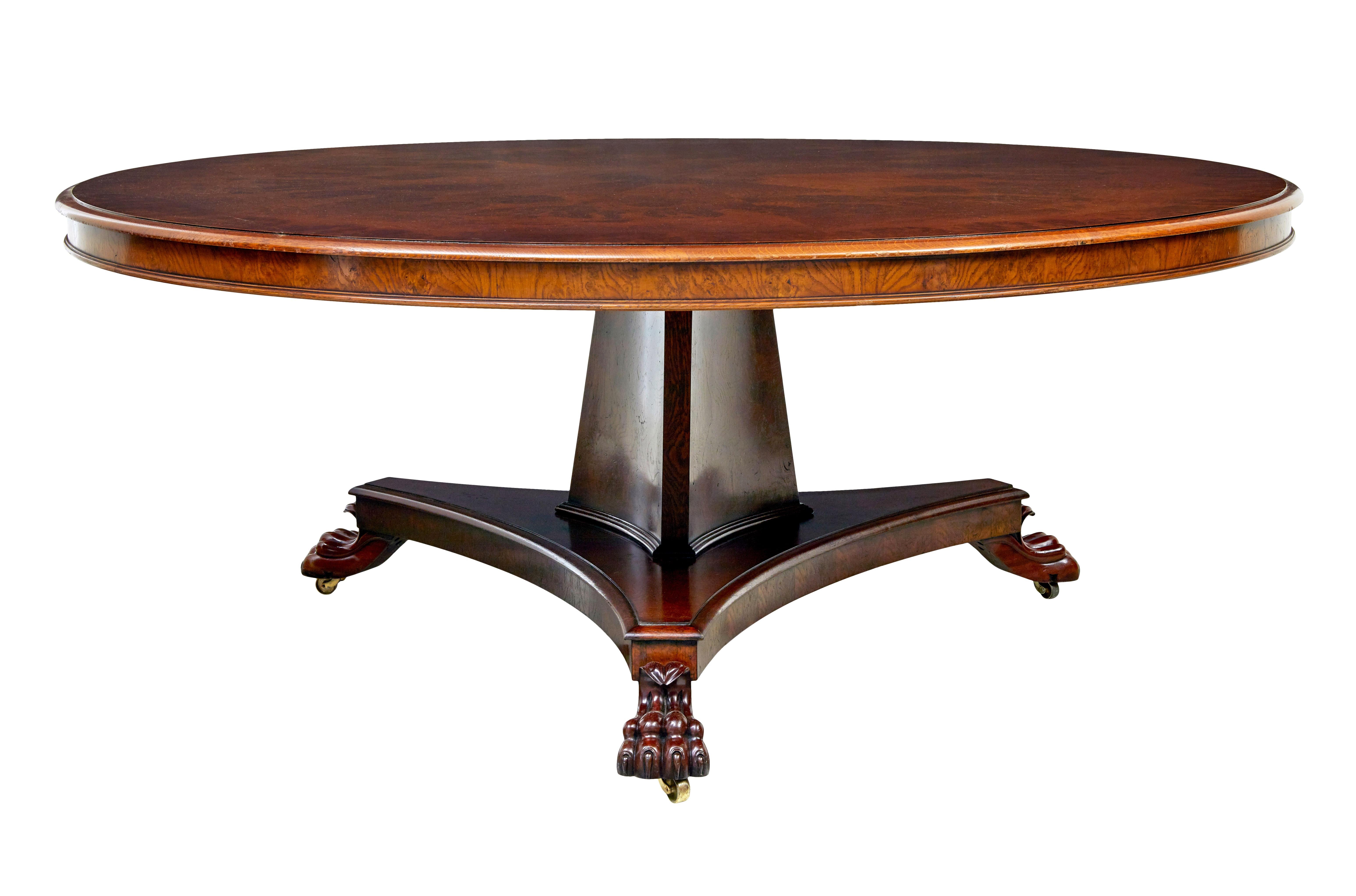 Large 20th century pollard oak dining table circa 1990.

Fine quality contemporary English made dining table using a 19th century design.

Round top with segmented pollard oak veneer and a deep rich colour, moulded edge, deep frieze which provides a
