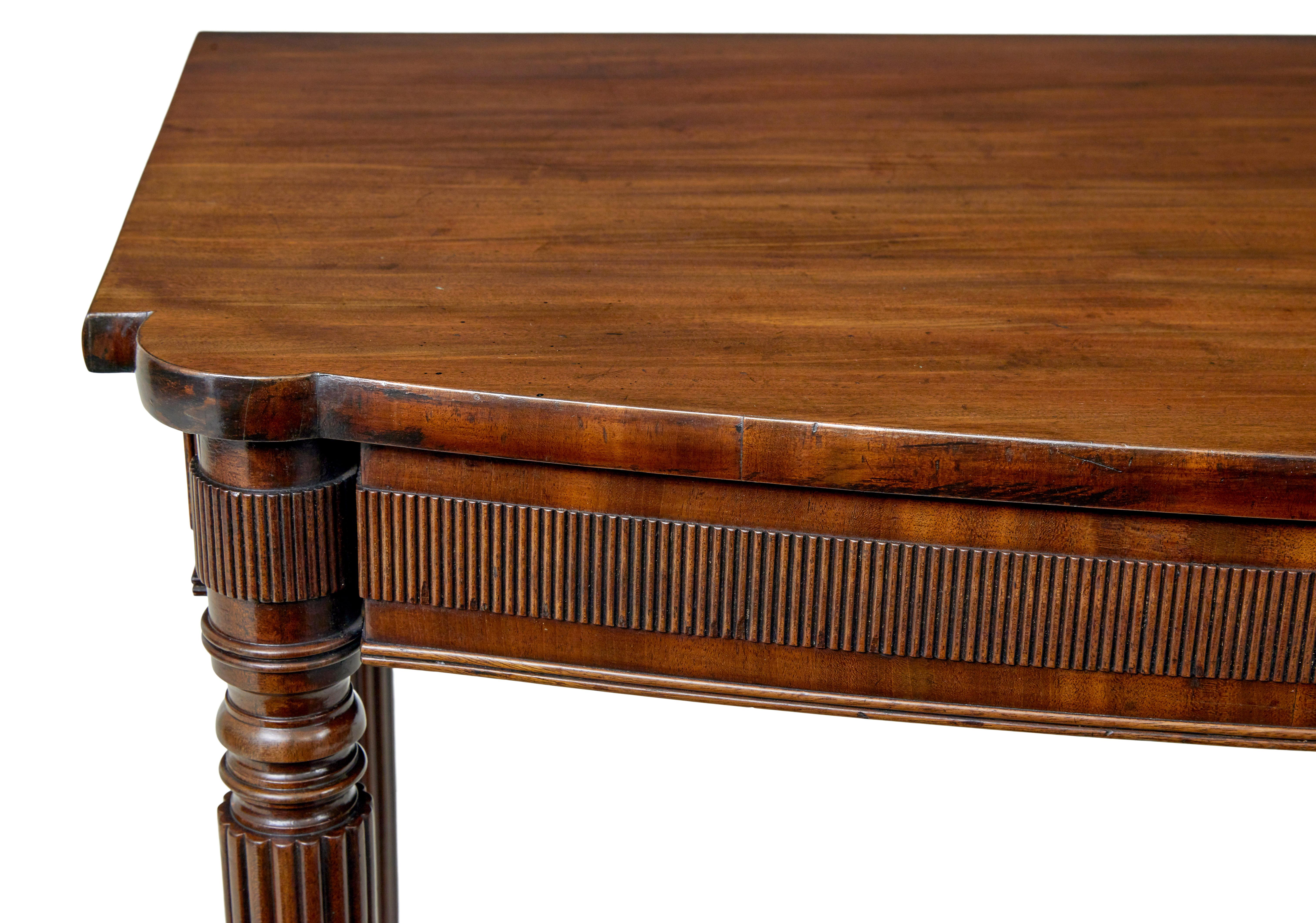 Early 20th century mahogany console table circa 1905.

We are please to offer this table which has multiple uses around the home.

Serpentine shaped front, with reeded frieze to the front and sides.  Raised on 4 turned and reeded legs.  Ideal for