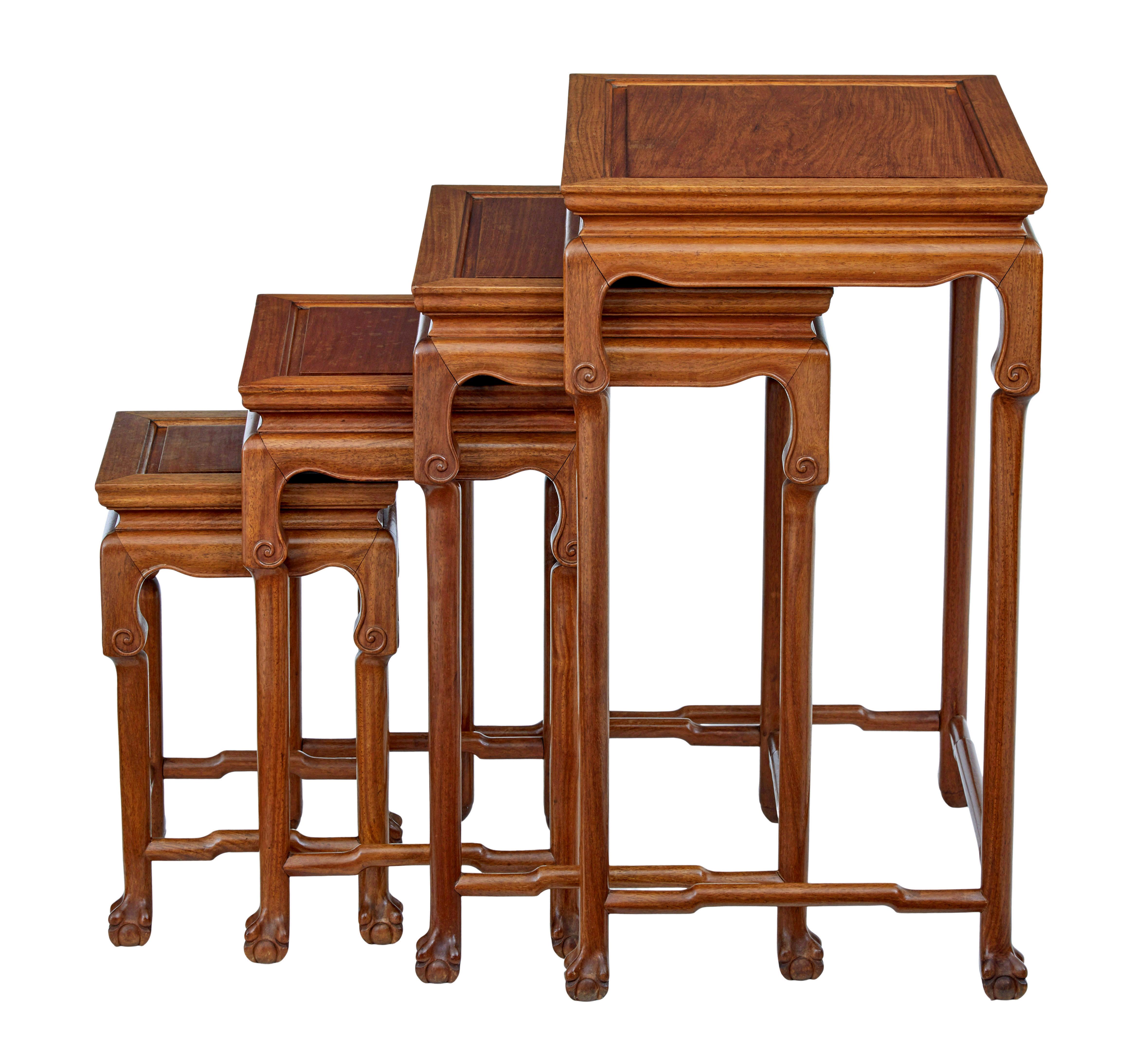 Good quality nest of 4 Chinese made tables circa 1950.

Made in hong kong by mayfair and company, retailed by tientsin bazaar in san francisco.

Rich golden colour with detailed top and scrolling carved on the frieze.  Straight legs, standing on