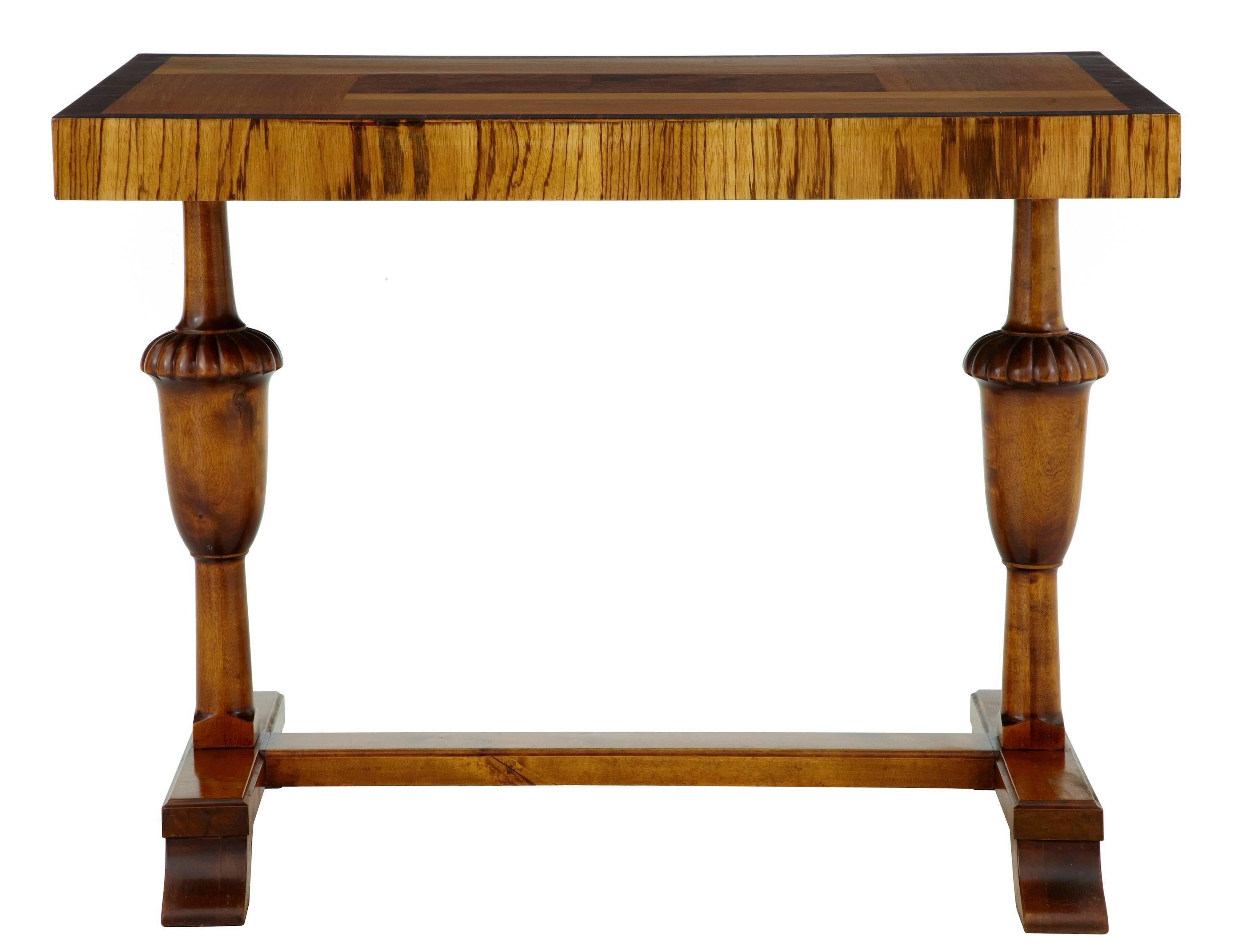 Birch inlaid occasional table, circa 1930.
Multi possible uses for this table.
Birch elm and rosewood veneers used to create this striking table.
Baluster support legs, united by stretcher.

Minor veneer losses to sides.

Height: 27