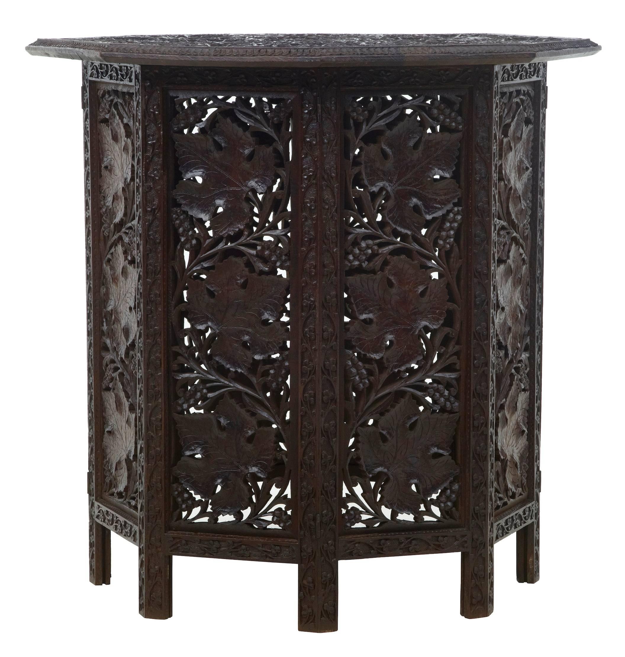 Fine quality pierced carved octagonal table, circa 1880.
Beautifully carved with leaves and vines.
Top is removable and sits on the base which is collapsible.
Measures:
Height: 25