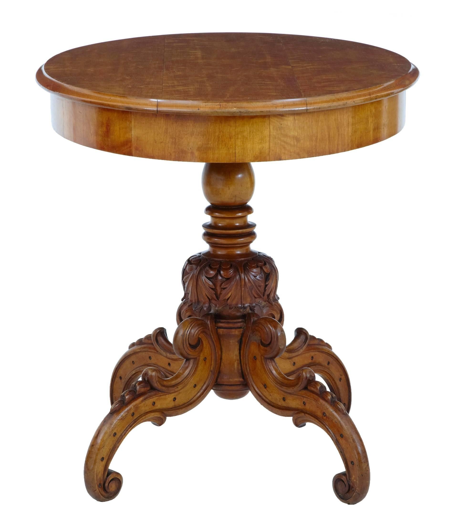 Swedish oval center table, circa 1870.
Rich golden color.
Turned and carved stem, standing on four scrolling legs.

Some minor losses to carving on stem.

Measures: Height 30 1/2