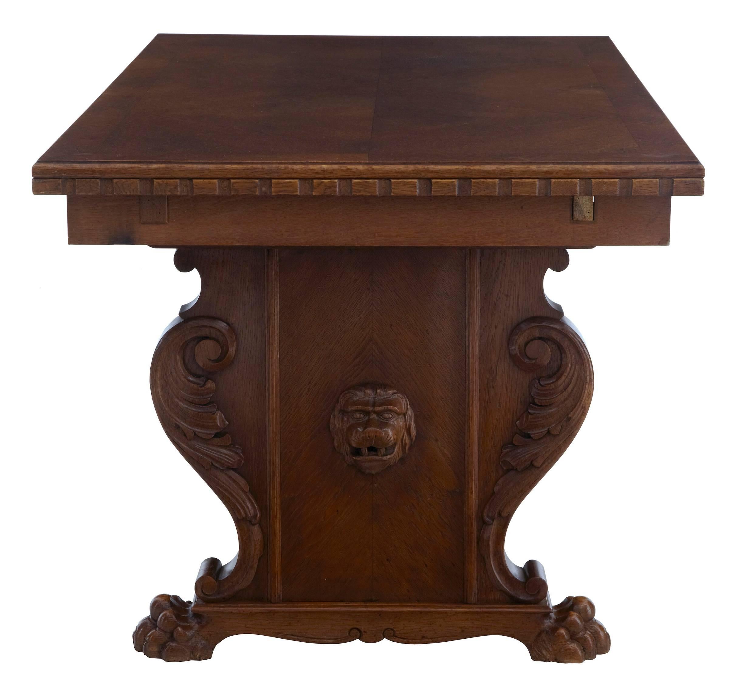 Carved oak trestle end table, oak top with pine draw-leaf slides.
Applied carved scrolls and lion head, standing on carved lion paw feet.
Some surface marks to top surface.
Measures:
Height: 29
