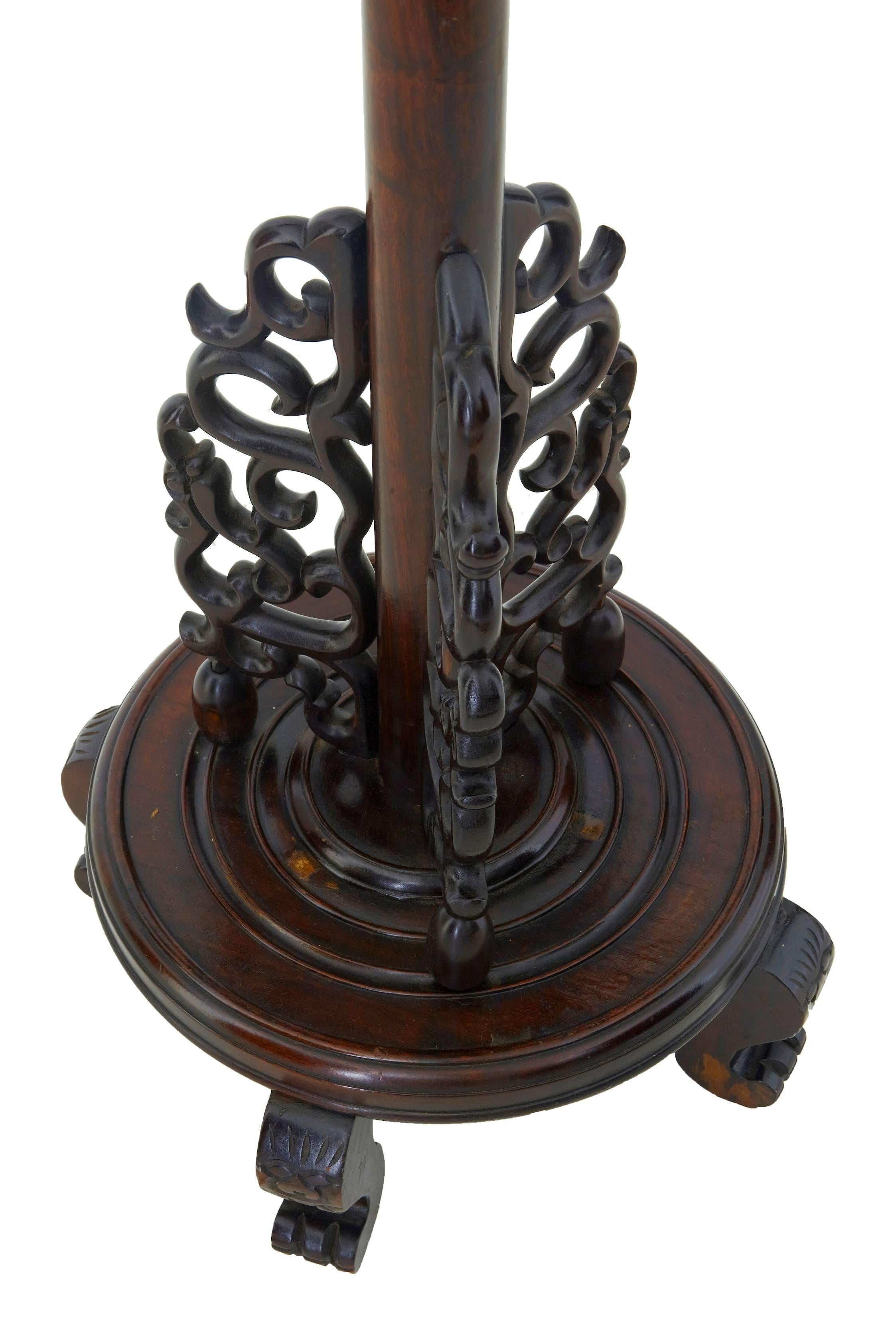 Good quality floor lamp, circa 1920.
Carved in heavy hardwood.
Carved dragons head forming the outlet for the light fitment, long stem leading down to three scrolled carved elements, round base, standing on 4 feet.

This item has just been re
