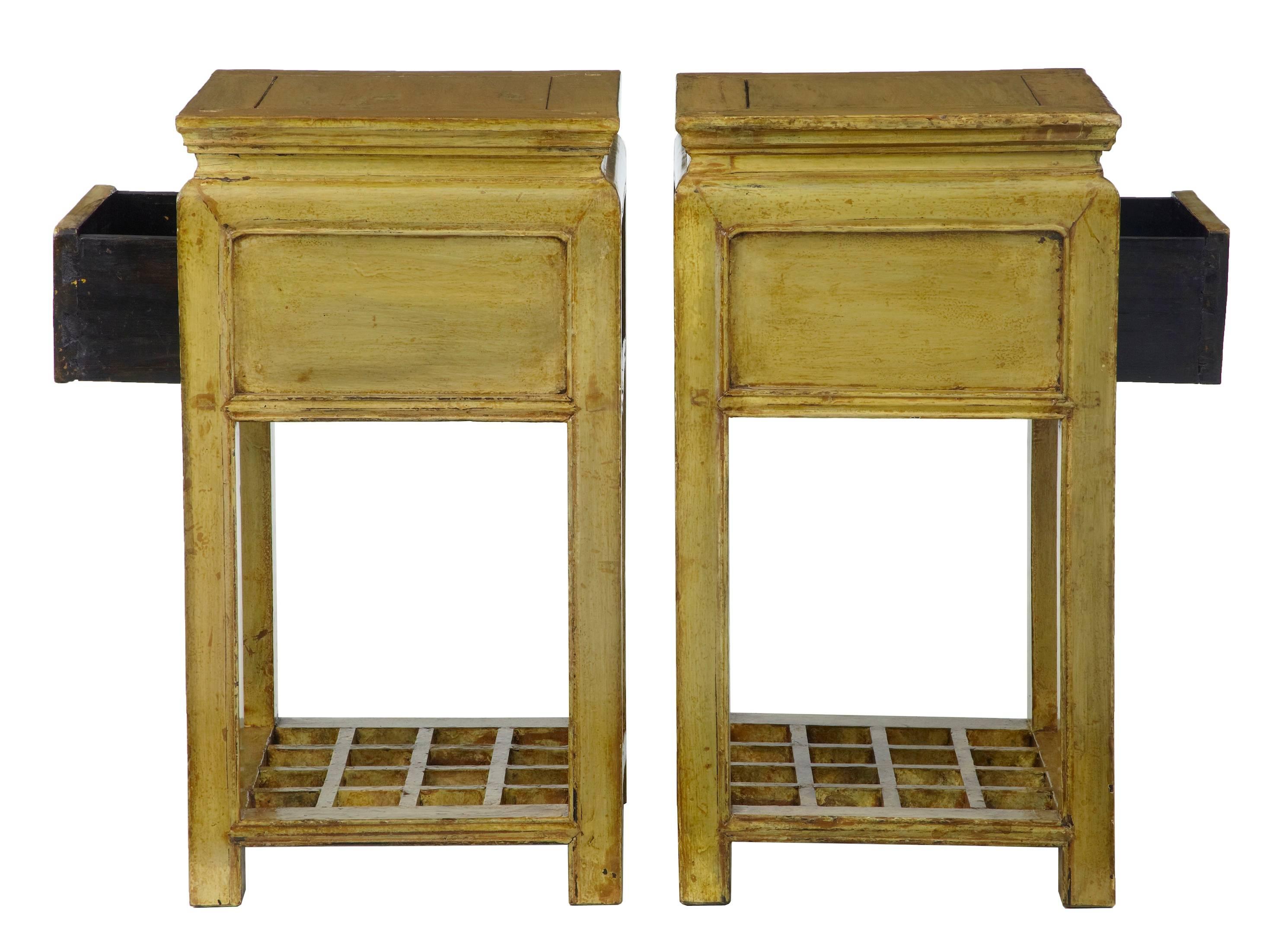 Striking pair of yellow lacquered occasional tables, circa 1890.
Both with single drawer to the front and straight lattice work shelf below.
Some wear and losses to paint below the lacquered surface.
Ideal in the bedroom or living