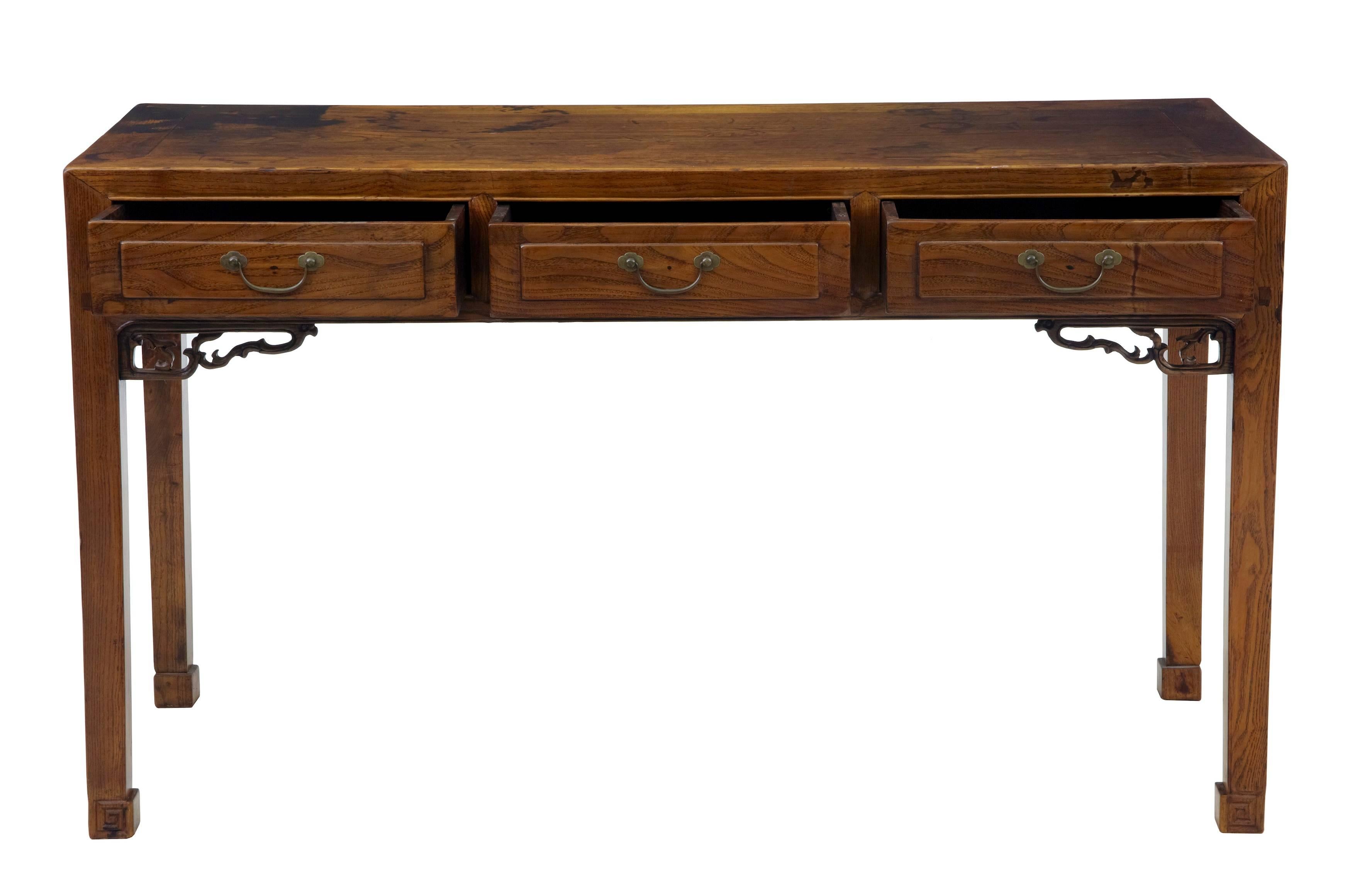 Rich colored Chinese occasional table, circa 1890.
Three drawers below which a carved detail to the front.
Heavy staining to the top which lends to its character.
Measures:
Height 31 1/2
