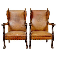 Pair of 19th century oak and embossed leather armchairs