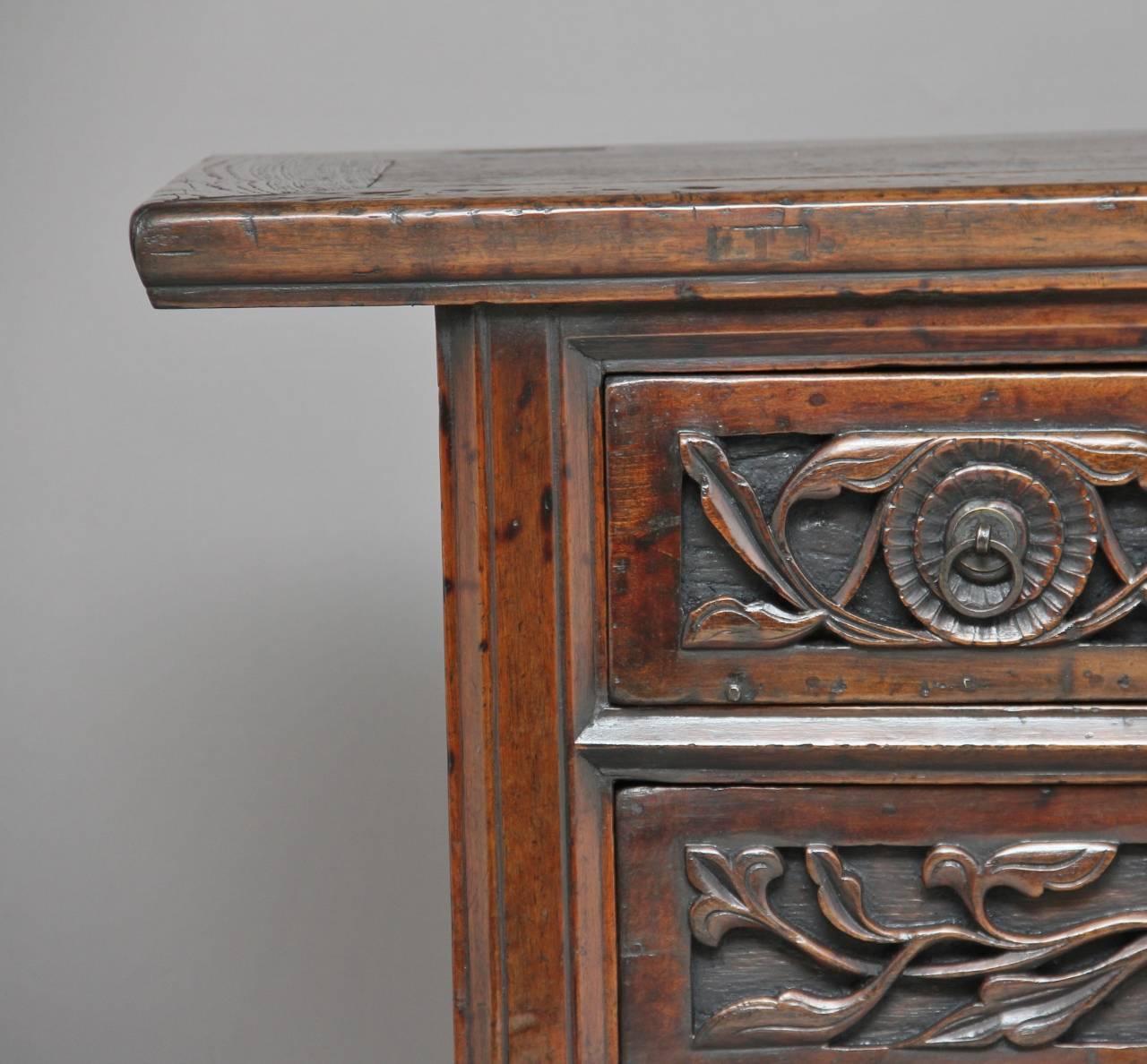 19th century Chinese elm dresser with two short over one long drawer with carved fronts, circa 1880.

Measures: Height: 33