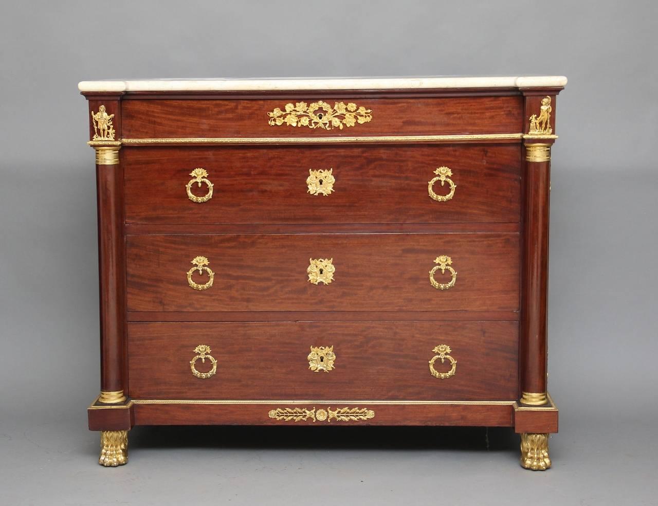 19th century French mahogany commode with a later marble top, decorated profusely on both sides and the front in original ormolu, the commode having a frieze drawer just below the marble top and three long oak lined drawers below flanked by ormolu