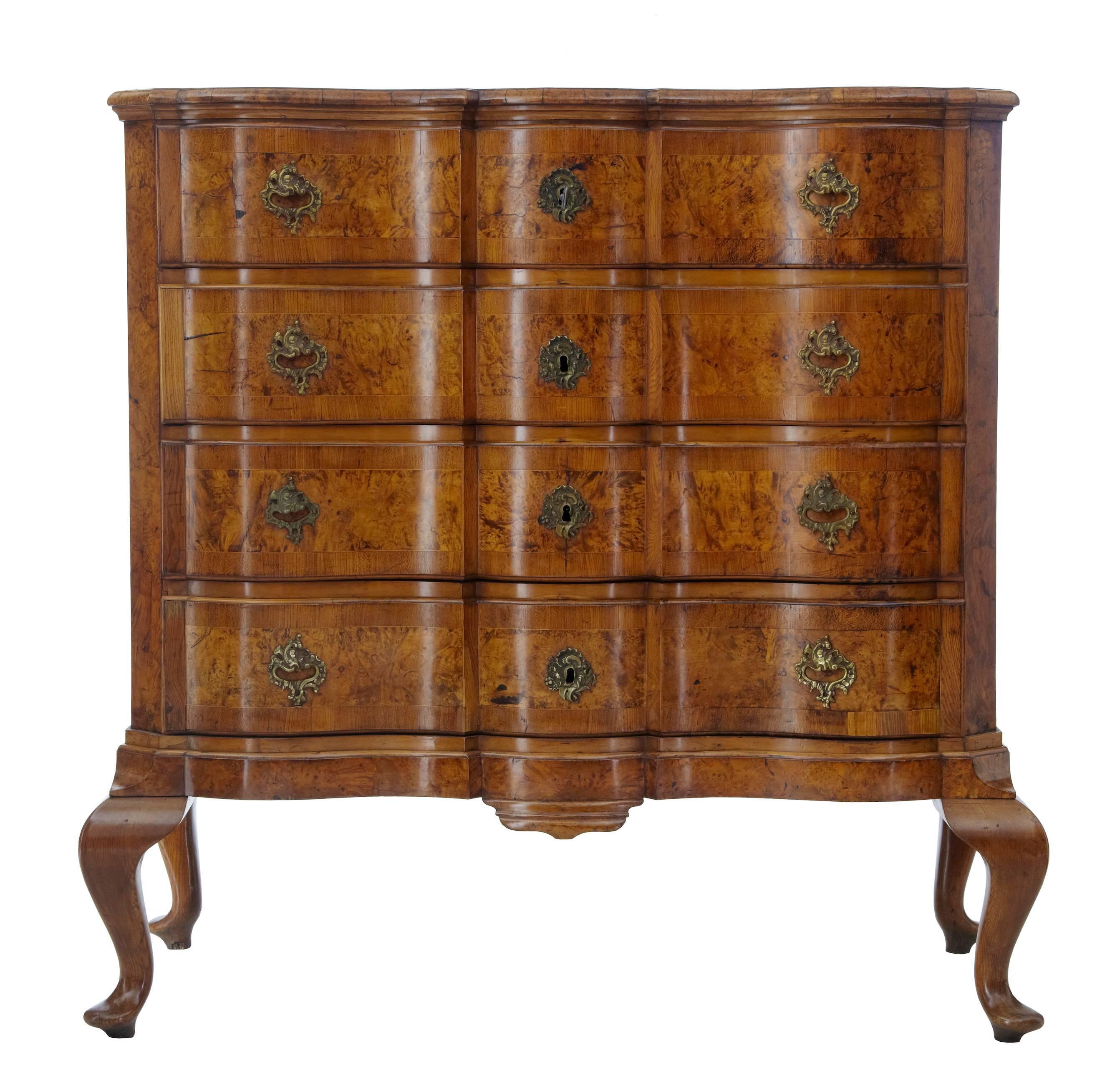 Stunning looking Danish alder root and walnut chest on stand, circa 1750.
Two part chest with the legs being separate.
Beautiful colour and use of the unusual alder root.
Four serpentine shaped front drawers with working locks and key.
Replaced