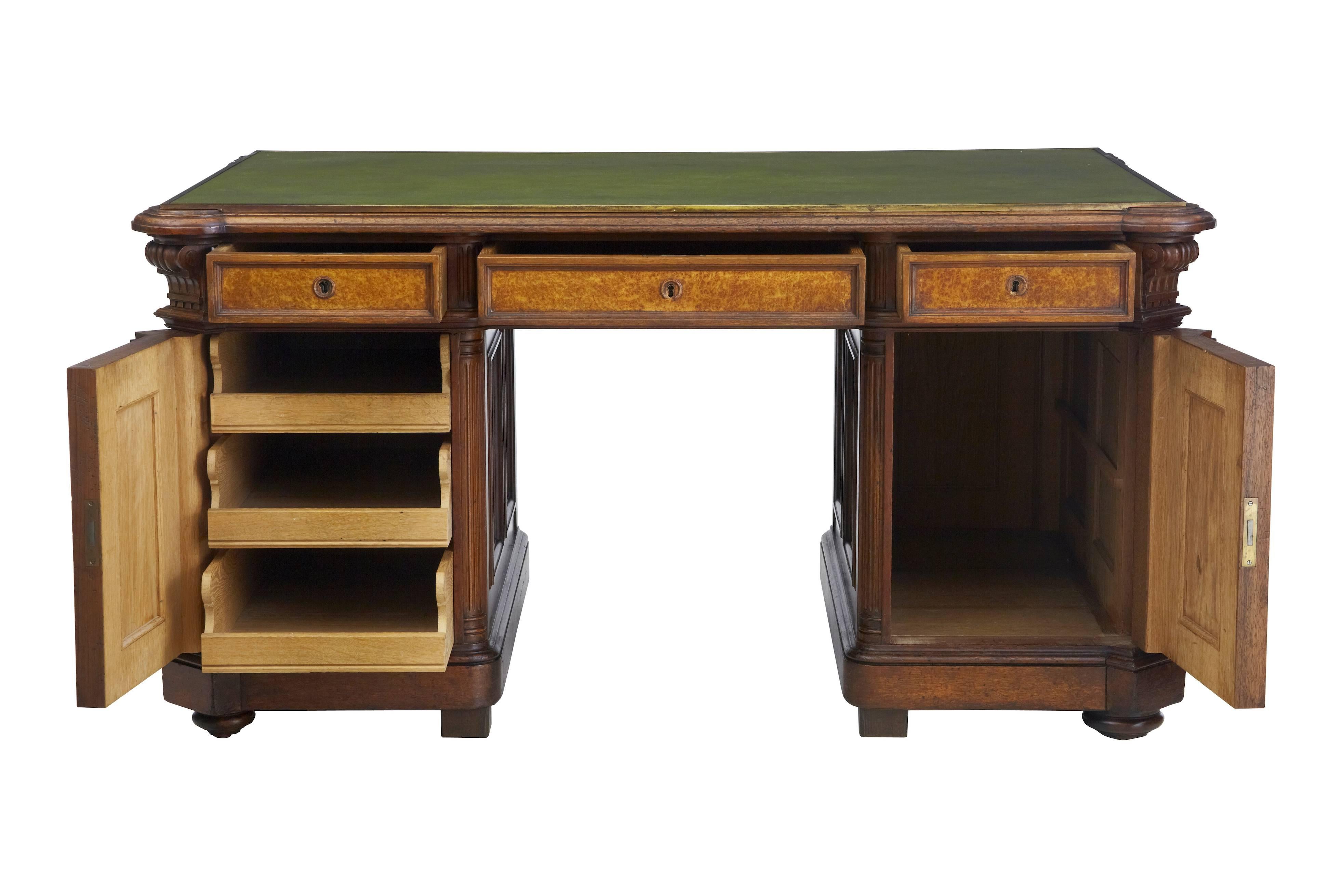 Good quality victorian oak and walnut desk, circa 1890.
One-piece.
Green leather top writing surface with brass edging.
Three drawers in the top, three slide drawers in the left pedestal. Right hand side currently with missing shelf (will be