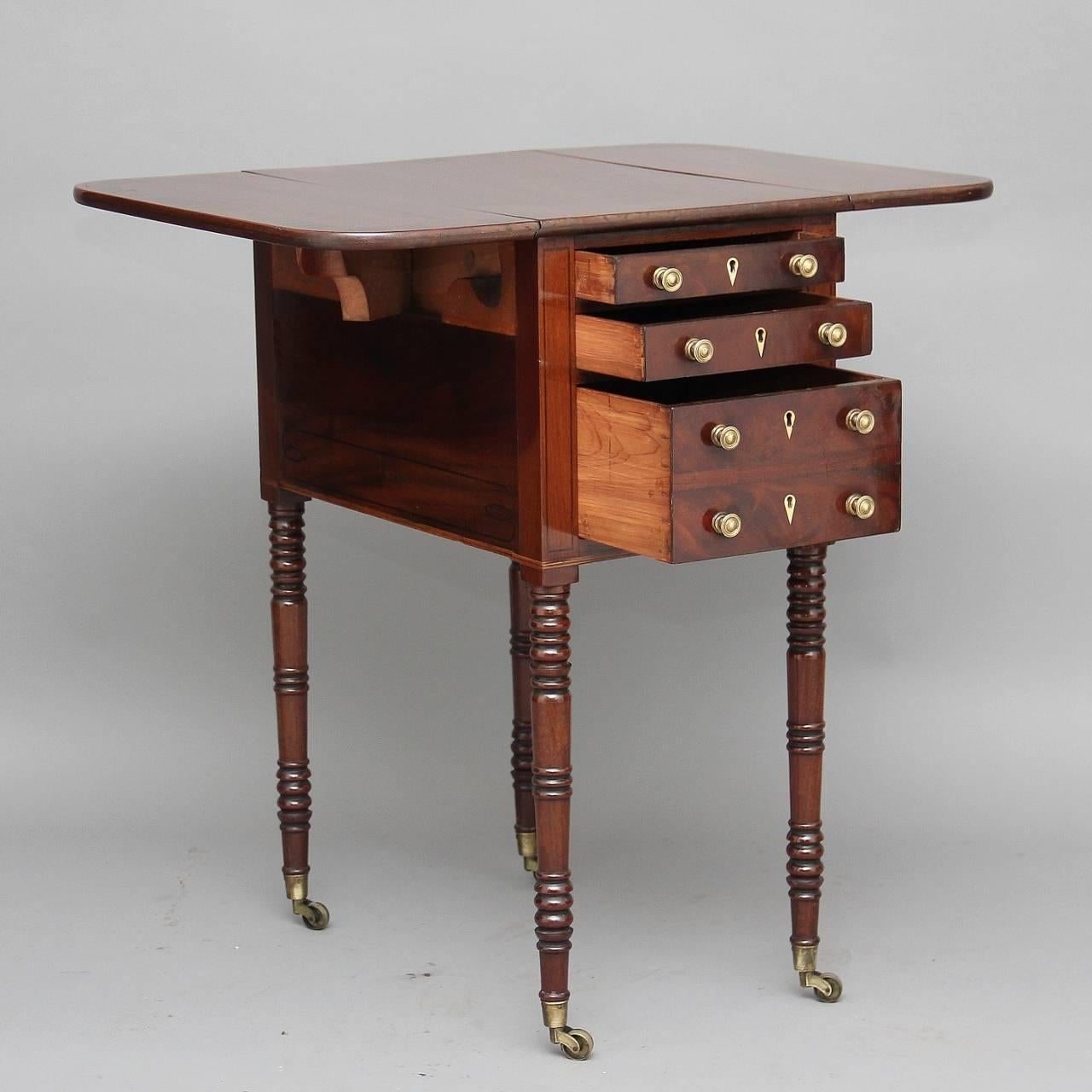 19th century mahogany drop-leaf or side table with a rosewood crossbanded top which extends to 28″ (73cms) with three cedar lined drawers below with original turned knobs, the reverse of the table is exactly the same just with dummy drawers, the