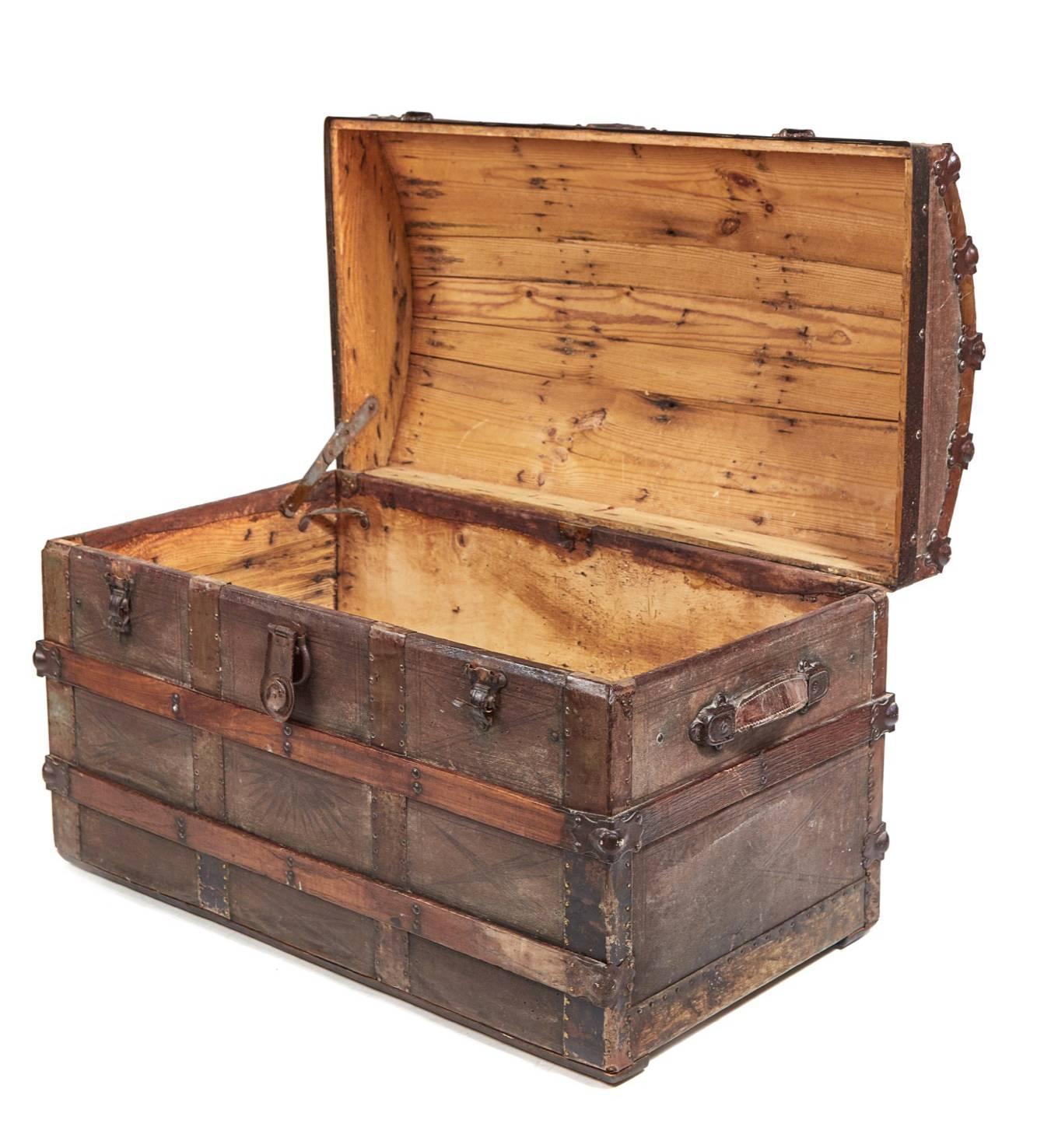 Unusual Victorian dome topped trunk with original leather handles fitted interior, the dome top has curved wooden strips running from side to side with metal and leather panels, the front sides and back have wooden strips with metal and leather