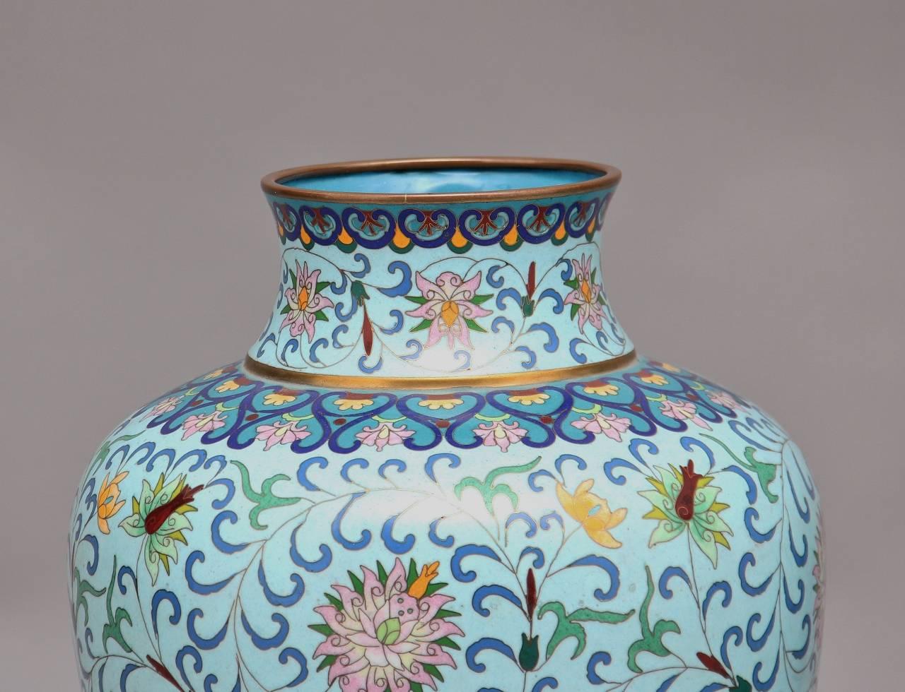 A pair of 20th century Chinese cloisonné enamel vases decorated in a lovely floral pattern, both vases in excellent condition

Foreign influence contributed to the development of cloisonné during the early 14th-15th century in China. The earliest