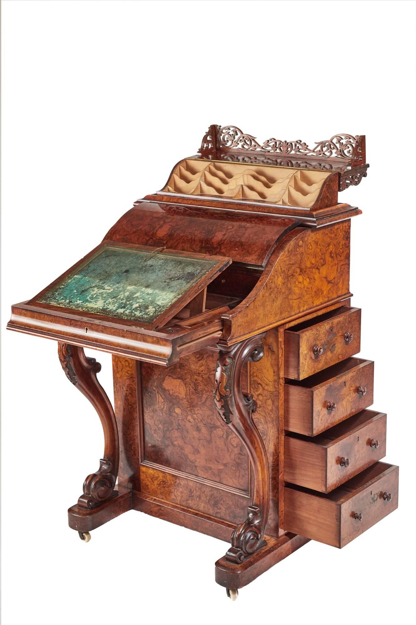 A fantastic burr walnut piano top Davenport, with a pop up top and a pull-out writing slide with the original tooled leather writing surface fitted lidded pen and ink boxes, secret button to release sprung top with a fantastic fretwork panel