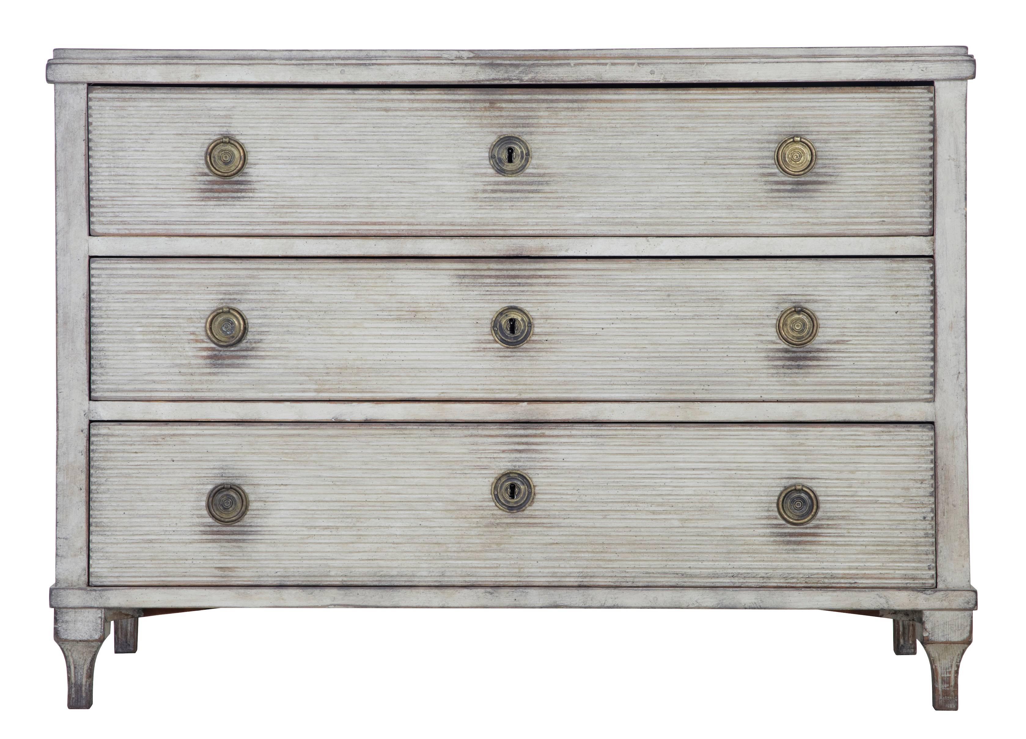 Good quality Swedish pine commode of large proportions, circa 1870.
Later grey paint, which has now taken on a shabby appearance.
Channeled drawer fronts, ring handles and working locks and key.
Some marks and minor pitting to the