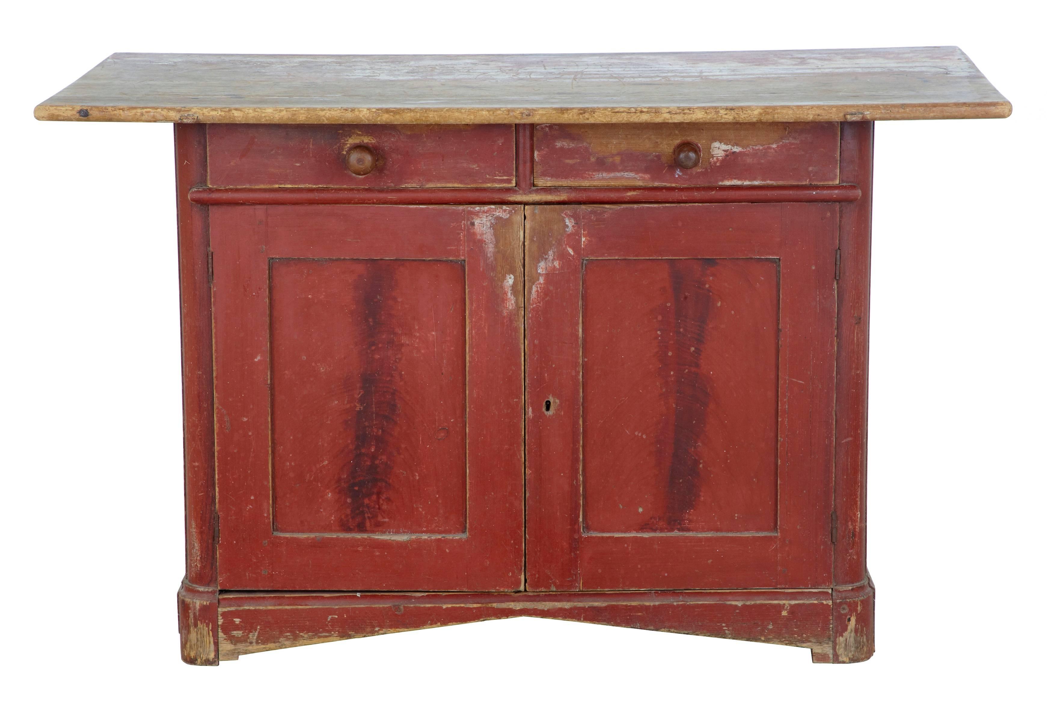 Rare rustic northern Swedish painted cupboard, circa 1870.
In its original paint, which has faded and worn giving its fantastic appearance.
Oversailing pine top, sitting above two drawers and a double door cupboard containing a single