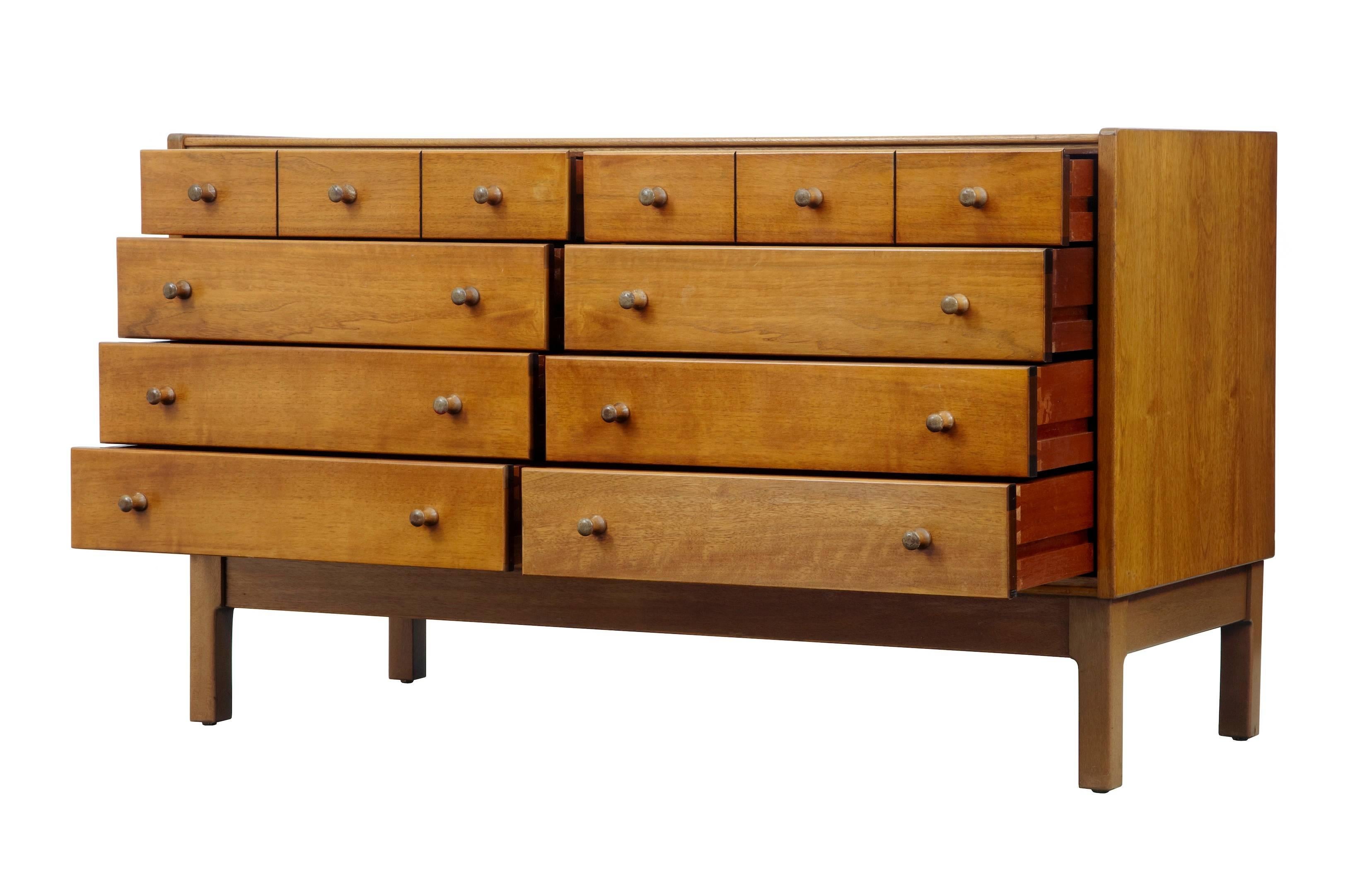 Good quality possibly Danish teak buffet or chest of drawers, circa 1960.
Eight drawers all velvet lined on the base. Top two drawers with partitions.
Peg handles.
Some fading and light marks to top.

Measures: Height 28 1/2