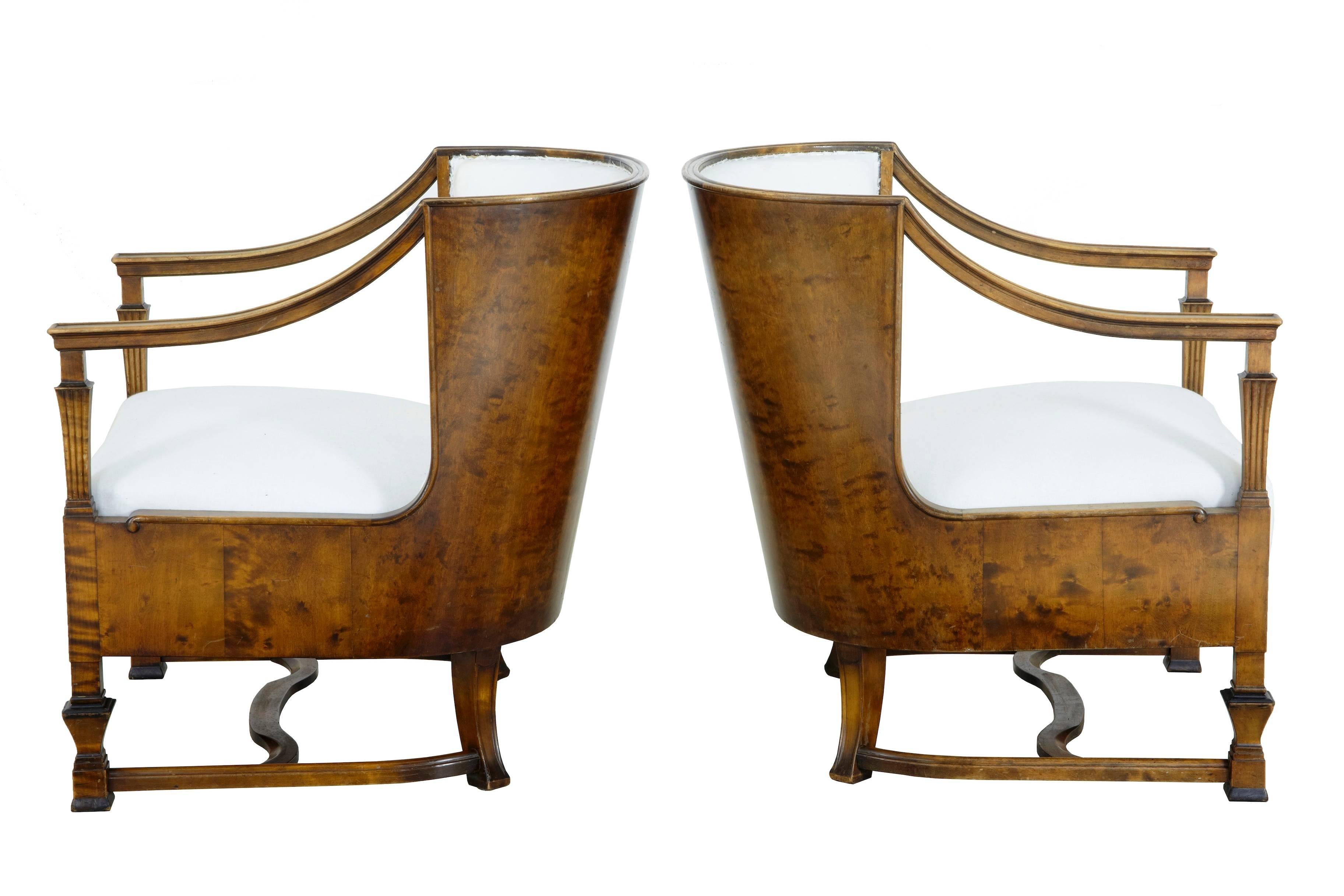 Here we have a pair of chairs of the finest quality from the deco period, circa 1930.
Beautifully made in matching stained birch veneers.
Wrap round backs, leading to the shaped arms which are supported by columns.
Legs united by stretcher.
Some