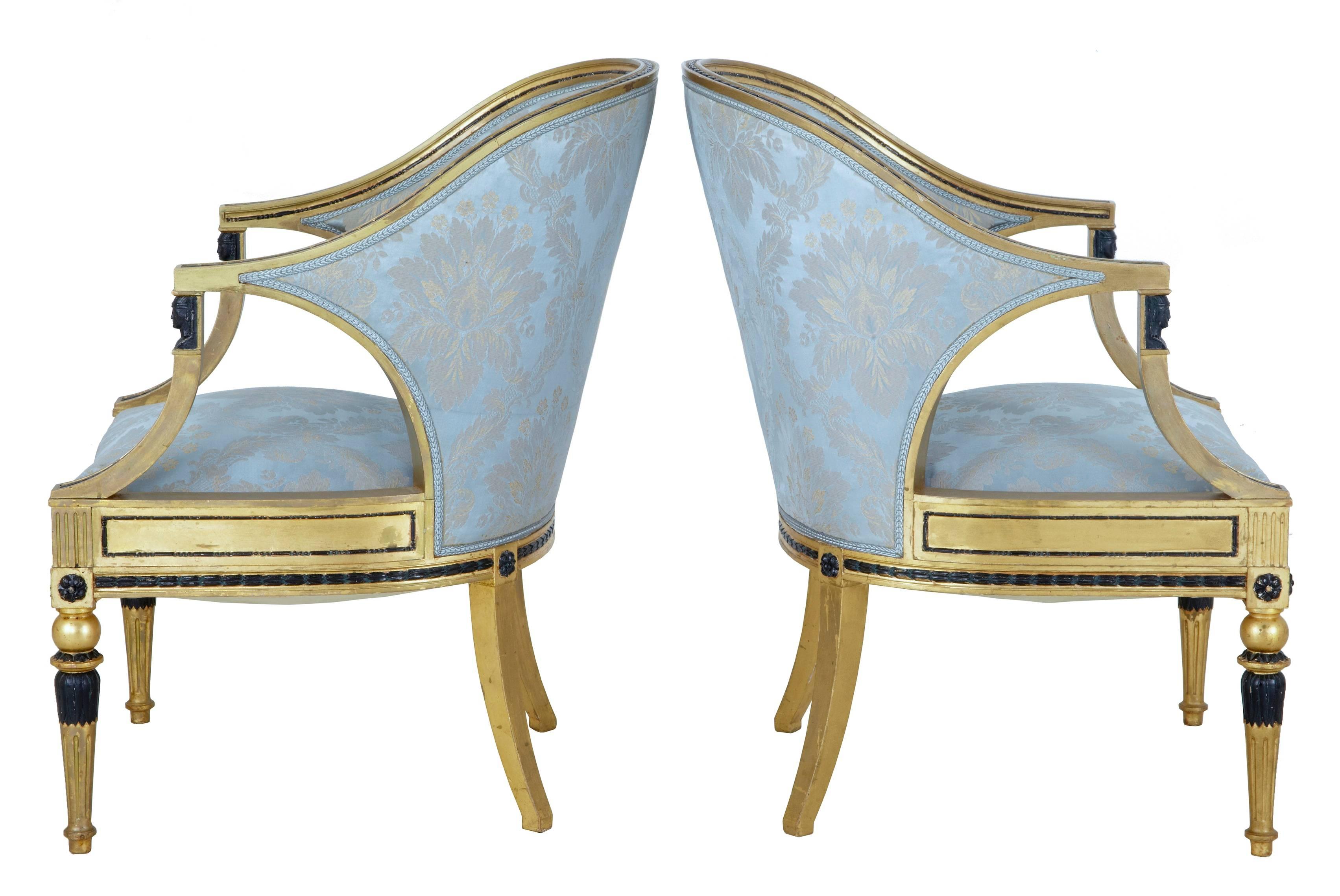 Fine quality pair of Swedish Gothenburg gilt armchairs, circa 1870.
Slipper like shaped backs, the shaped arms supported by ebonized Egyptian influenced mounts.
Ebonized leaves flow down the arms and around the frieze.
Standing on front fluted