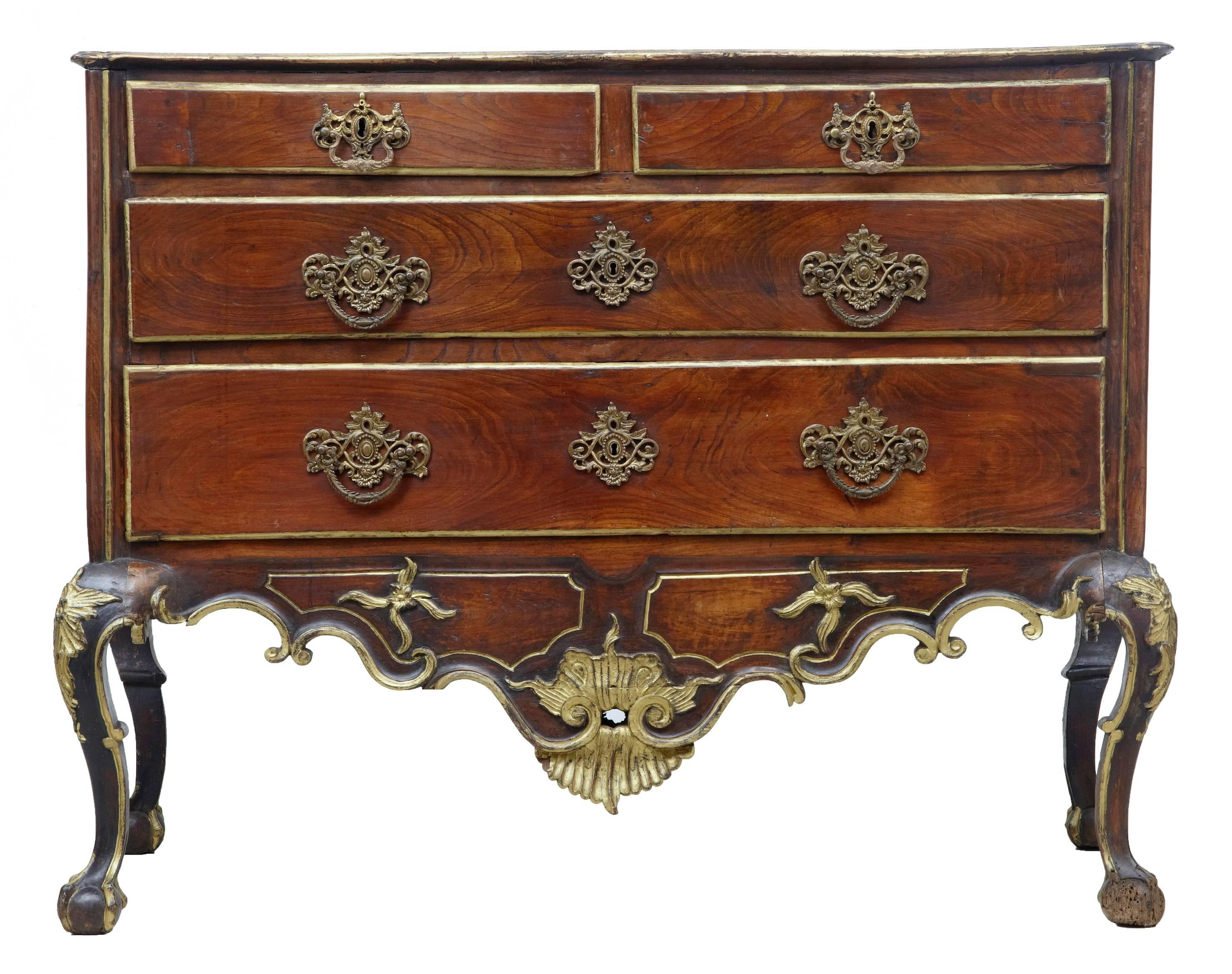 Excellent quality Dom Jose period commode, circa 1770.
Two short over two long drawers.
Profusely carved and detailed with parcel-gilt decoration, shells to the front frieze and sides.
Standing on cabriole legs and ball and claw feet.

Minor