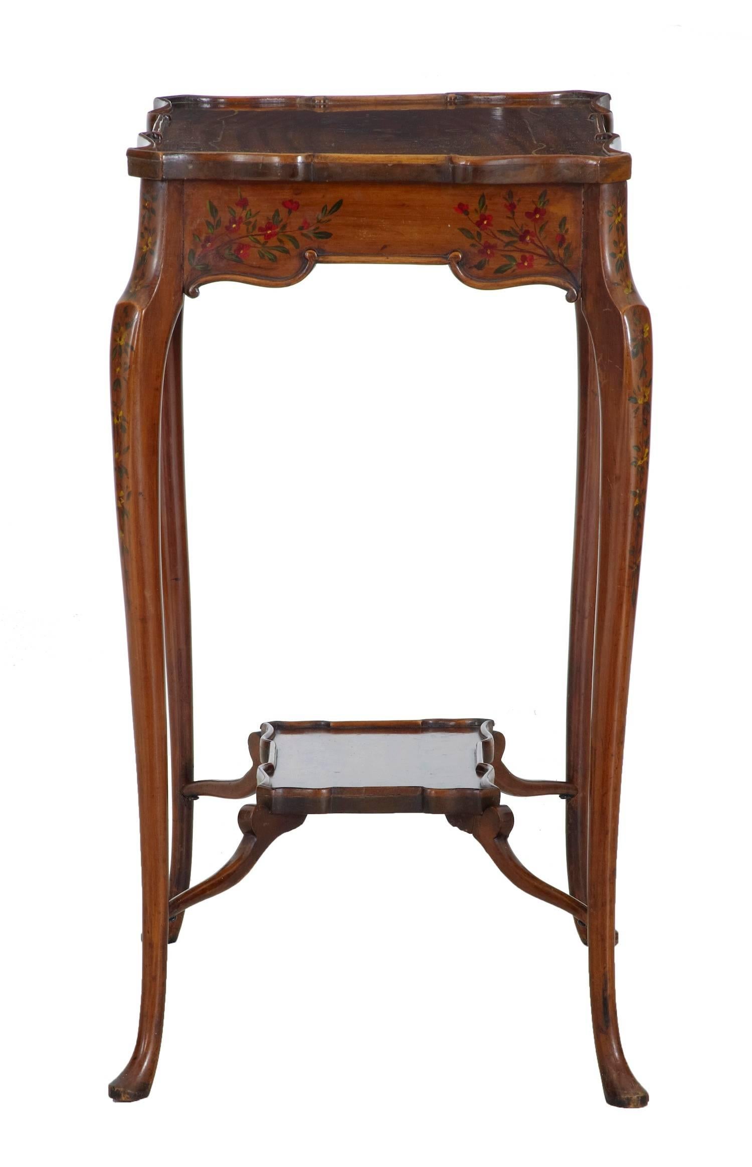 English Sheraton Revival side table, circa 1905.
Delicately hand-painted all-over.
Shaped scalloped top which is echoed by a second tier below.
Standing on pad foot.
Some natural fading, minor marks to woodwork.
Measures: Height: 26