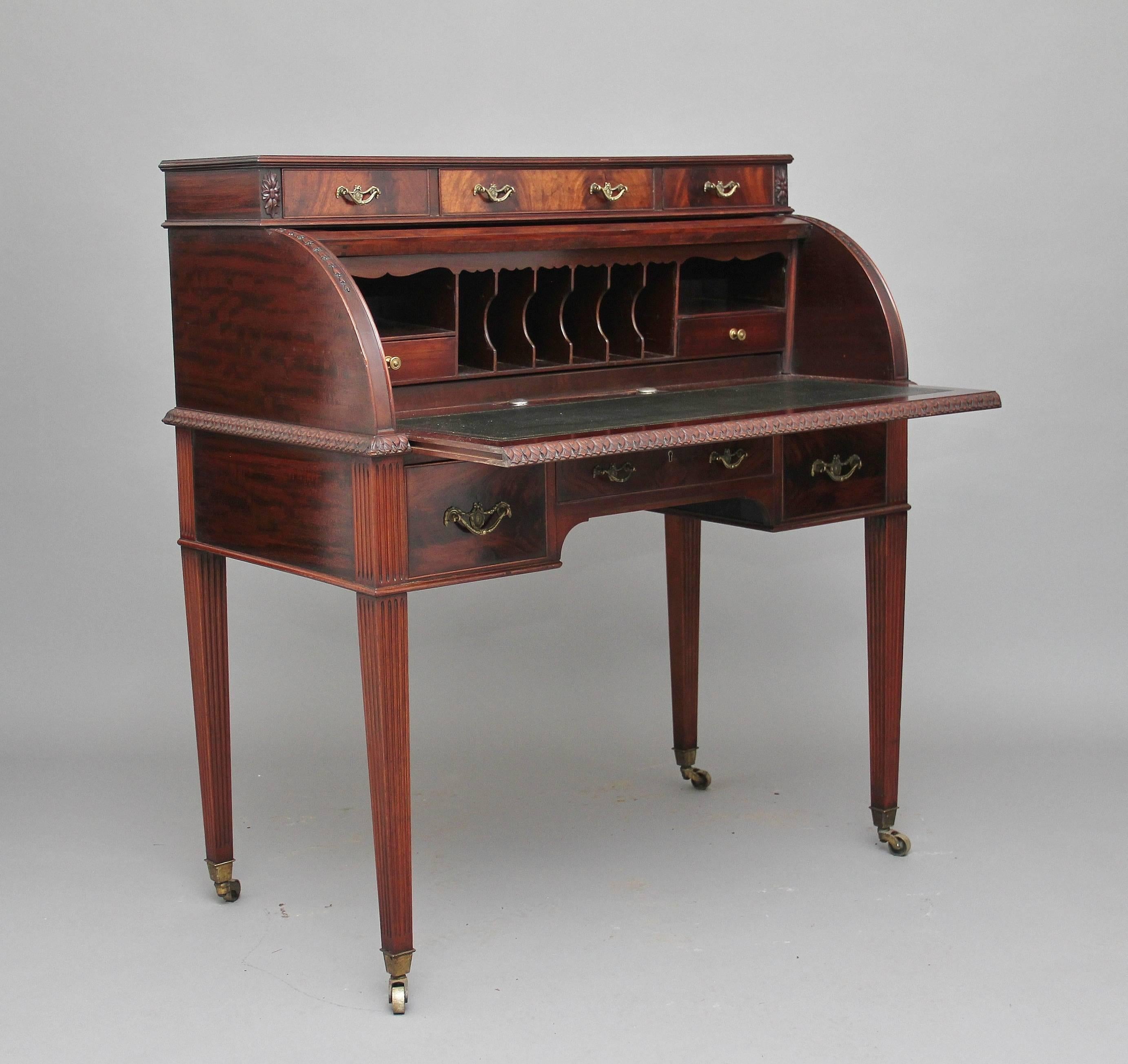 Early 20th century mahogany cylinder desk, the top structure having three drawers above the cylinder which are automatically locked once the cylinder is closed, with a lovely fitted interior inside with various compartments and drawers, with a