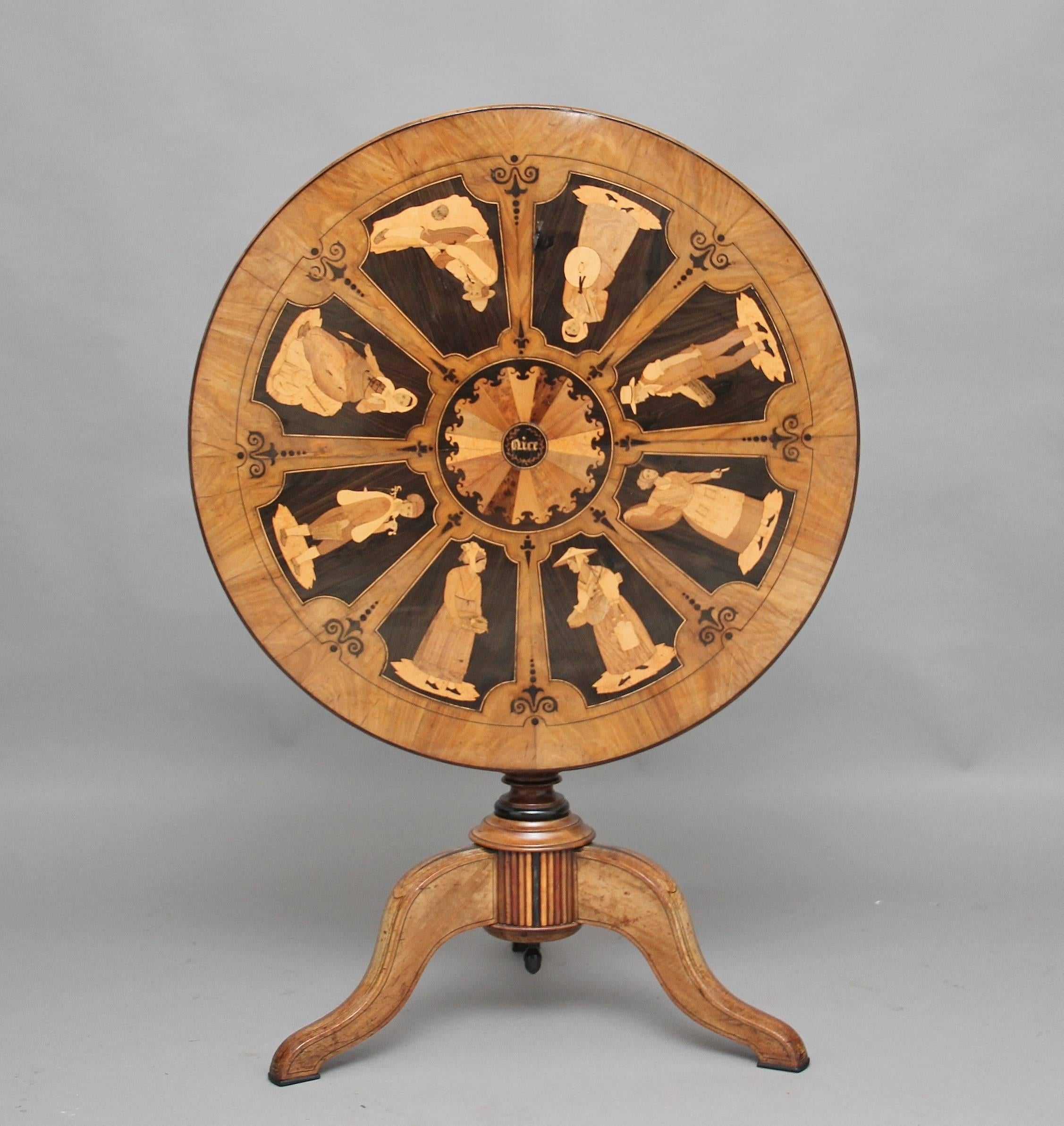 An exhibition quality 19th century Sorrento marquetry tripod table, the table is made from olive wood, ebony and other exotic woods, the top inlaid with eight figures of various country folk of the region, the center of the top having a circular
