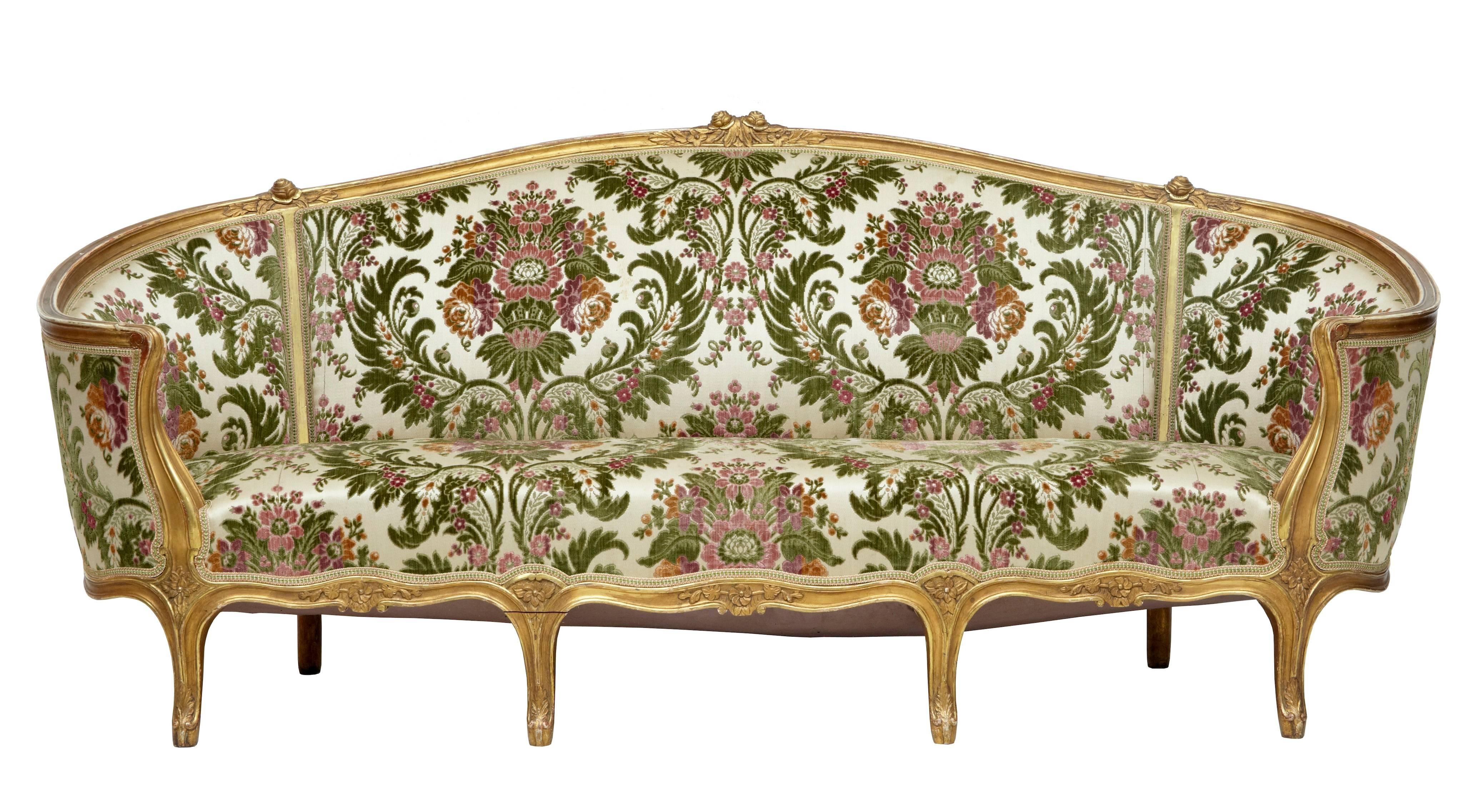 French five piece suite comprising of one sofa, two armchairs and two single chairs, circa 1880.
Beautiful sofa with flowing arms, complemented by matching chairs.
Finely carved detail to back rests and frieze.
Floral upholstery in good order.