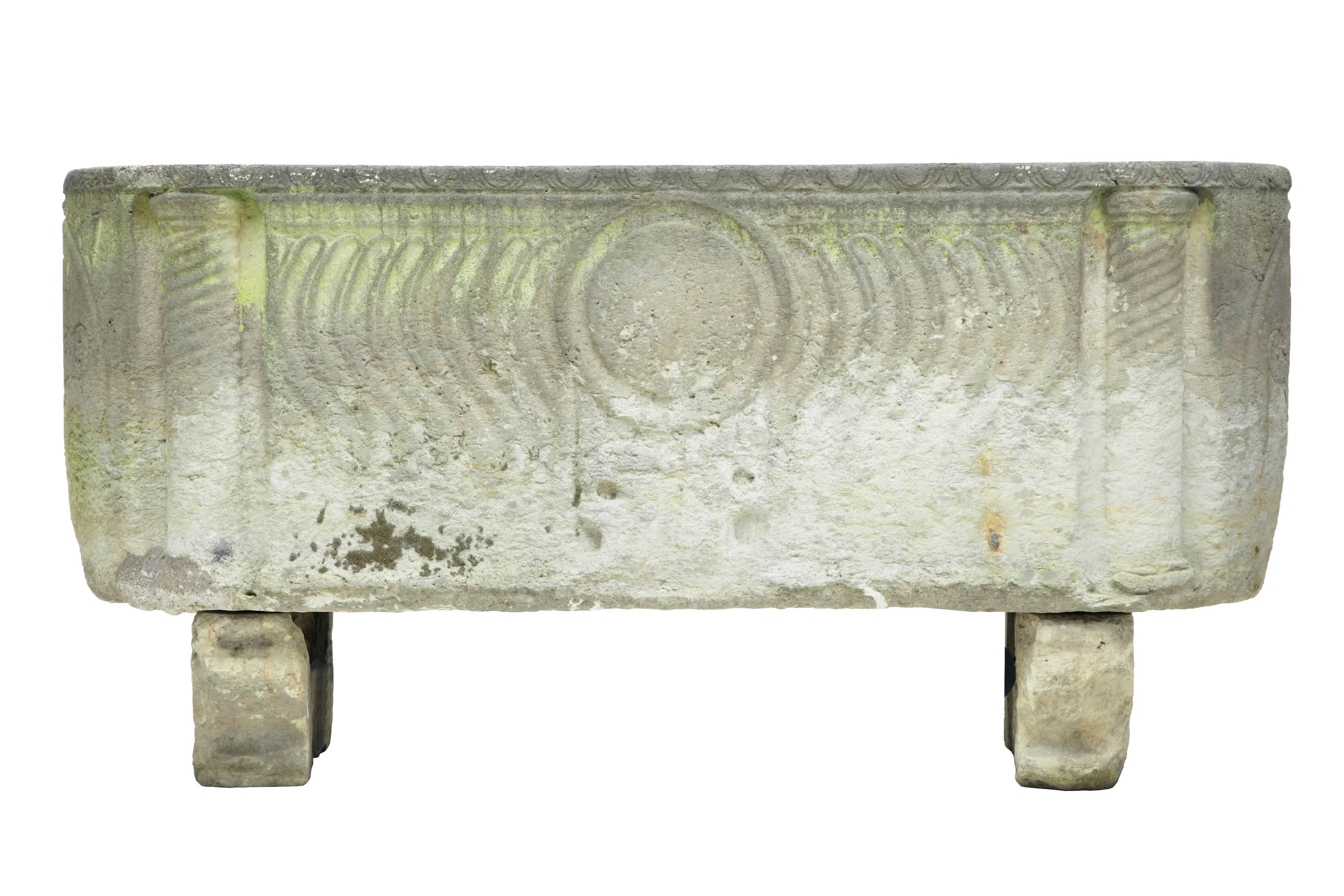 A stunning Anglo Roman sarcophagus in limestone, sitting on sledge feet and having curved
strigilated side carvings with warrior shield and two crossed arrow symbols at each end.
This unique piece was discovered in a Copenhagen garden. Although