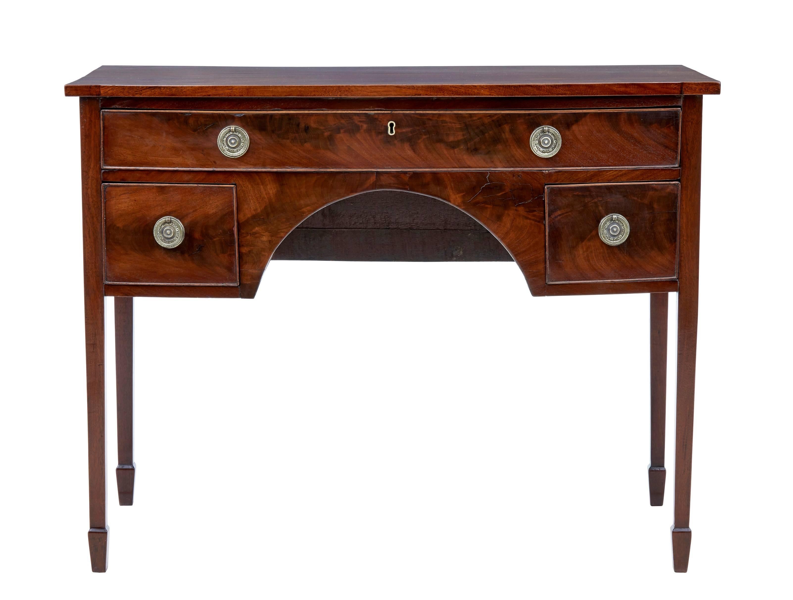 Small mahogany sideboard, circa 1830.
Three drawers, top drawer being the full width of the front.
Good color, standing on tapered legs.
Replaced handles but period replacements.
Minor expected age splits.
Measures: Height 32
