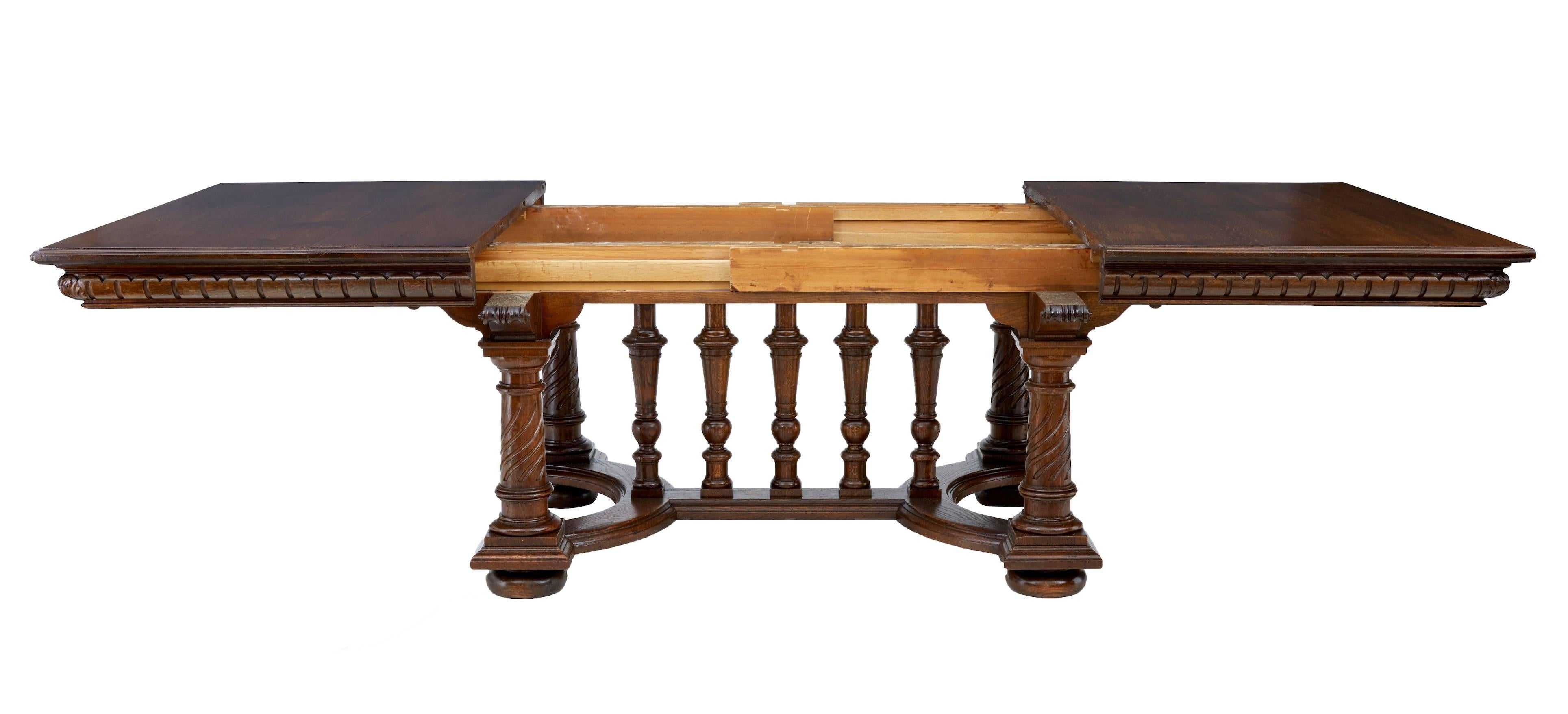 Large oak extending dining table that seats a comfortable 12, circa 1880.
Oak base and top with two additional pine leaves.
Oak top stands on four turned legs with candy twist detail. Horseshoe stretchers with five turned column