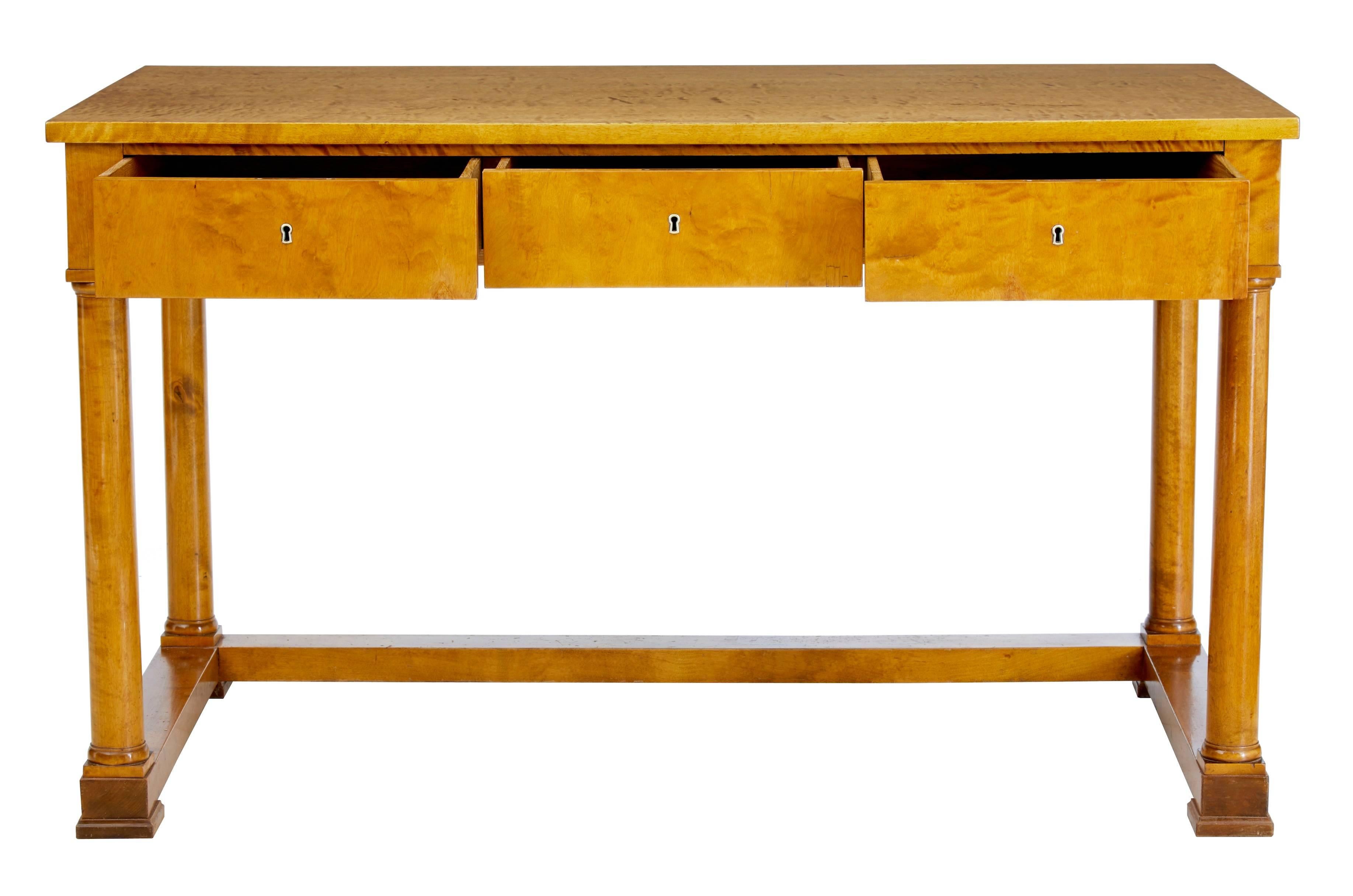 Swedish Empire revival birch desk, circa 1880.
Elegant table in fine birch veneers. Three oak lined drawers to the front.
Standing on four column turned legs, united by stretcher.
Minor veneer restorations.
Measures: Height 30 1/2
