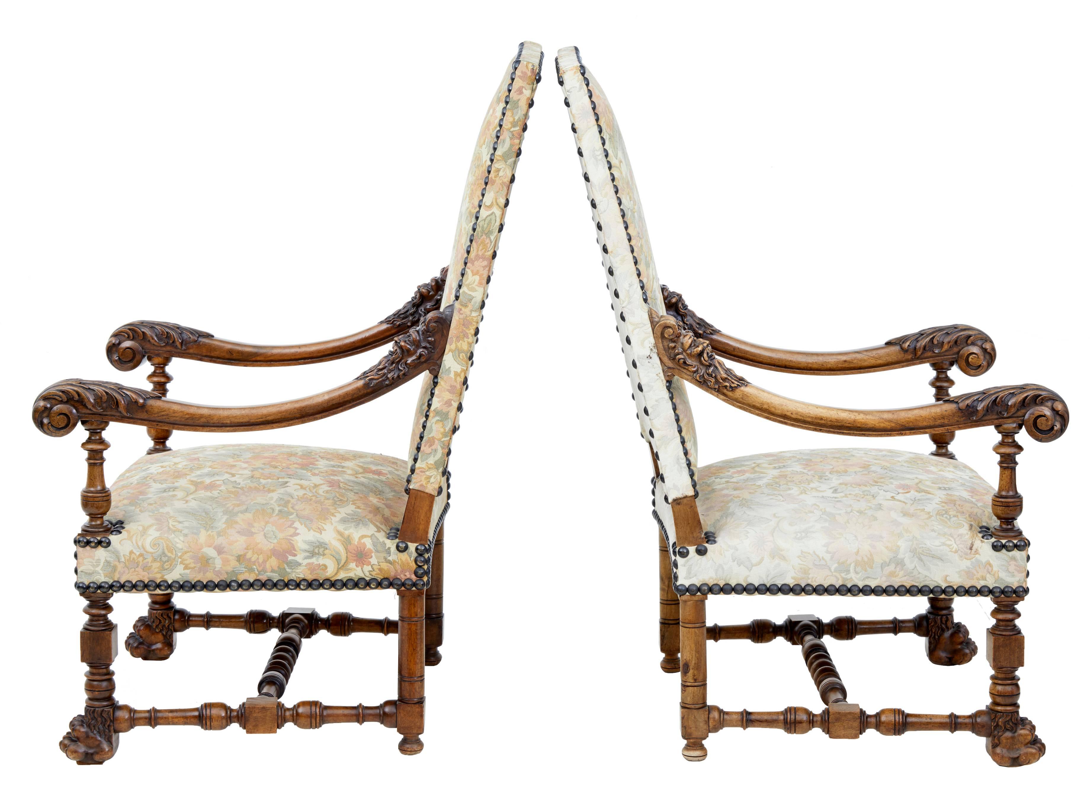 Beautifully carved pair of French armchairs, circa 1870.
Of good large proportions.
Carved mythical heads to the top of each arm, scrolling arms.
Standing on lion paw front feet united by turned stretchers.
Tapestry covering in good order, one
