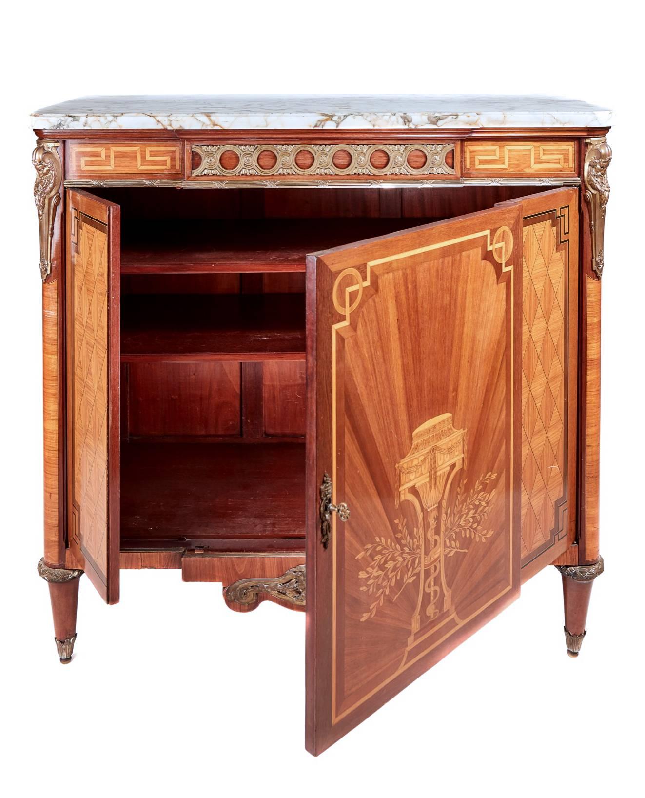 A quality French marquetry and parquetry ormolu-mounted breakfront side cabinet, with original breakfront marble top, inlaid and ormolu frieze, lovely marquetry panelled door with kingwood star burst veneer, to either side lovely parquetry panels,