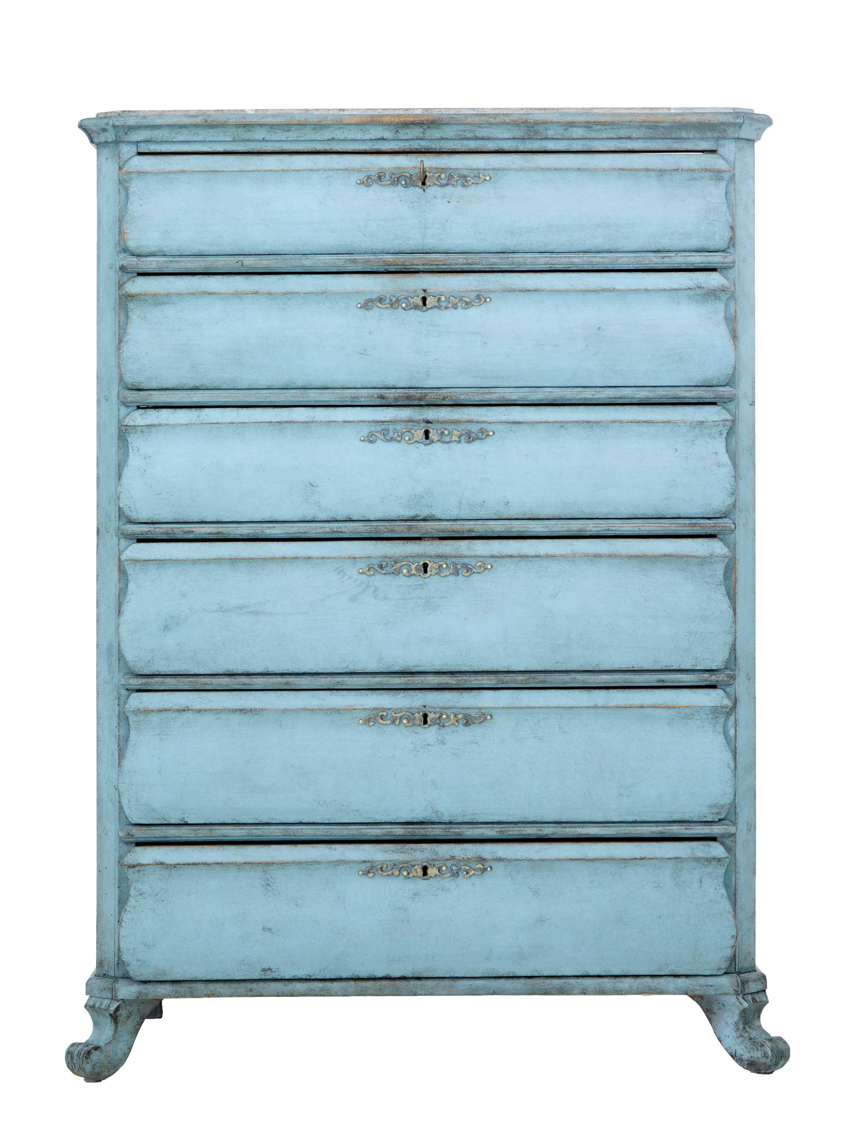 Six-drawer pine tall boy chest of drawers, circa 1870.
Shaped front drawers that open on the key.
Faux marble painted top, with later distressed paint in typical Swedish colors.
Scrolling feet to the front and block feet to the back.

Some