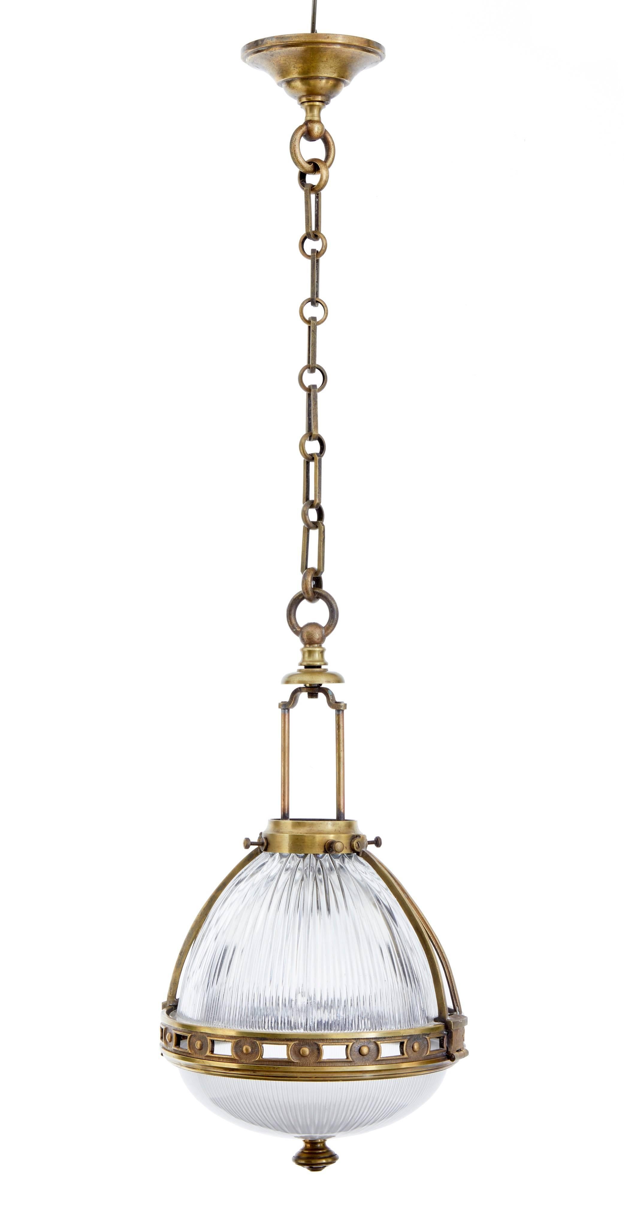 Good quality brass ceiling lights, circa 1930.
Two part glass, with cut-glass to the top and frosted glass to the bottom, encased in a decorative brass frame.
Each containing two-light fittings.
Currently unwired.

Measures: Height 39
