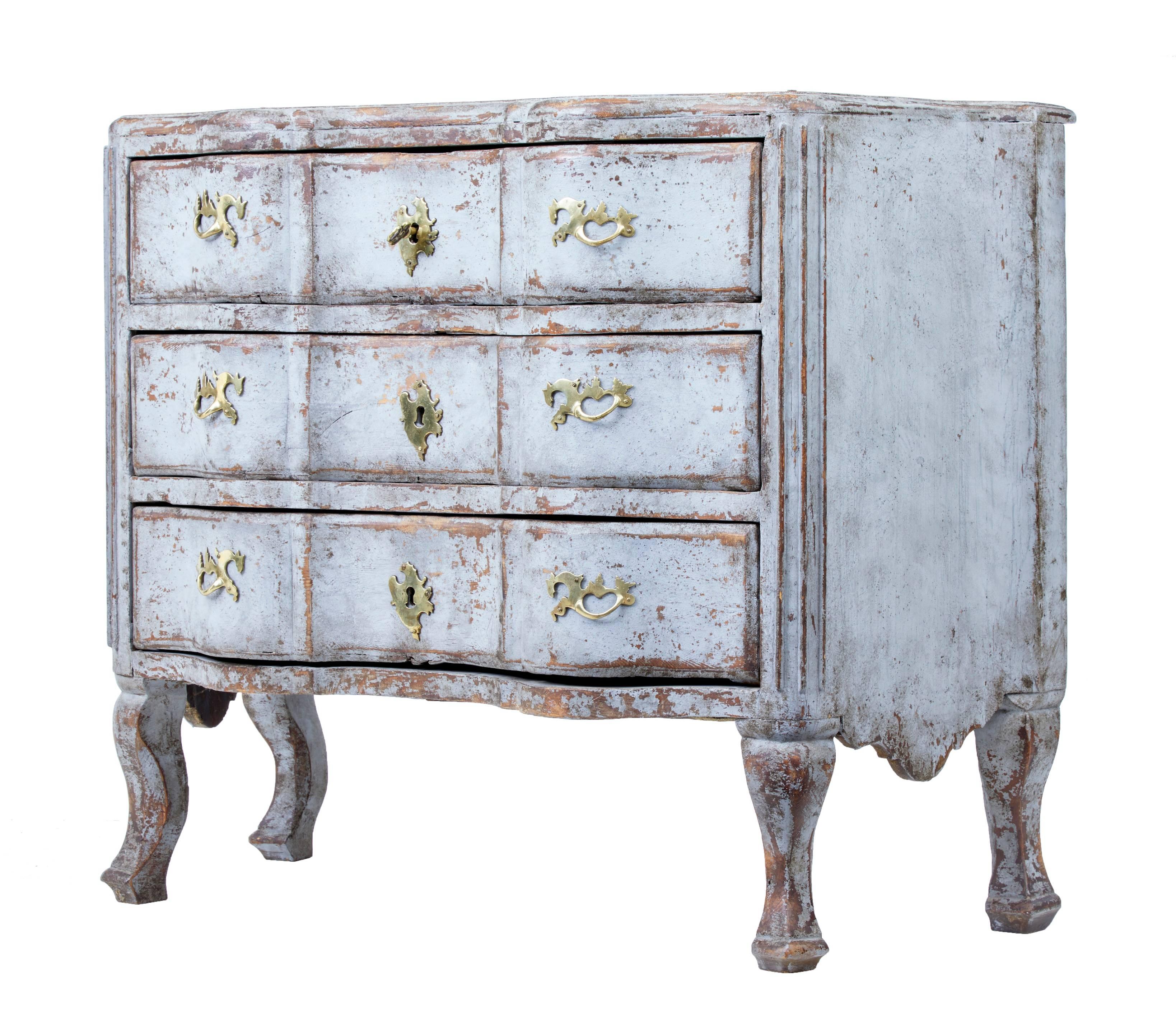 Fine quality Swedish pine chest of drawers, circa 1810.
Three-drawer chest with beautifully shaped front.
Later paint with now weathered appearance. Faux painted marble painted top.
Later brass handles.


Measures: Height 34 1/2