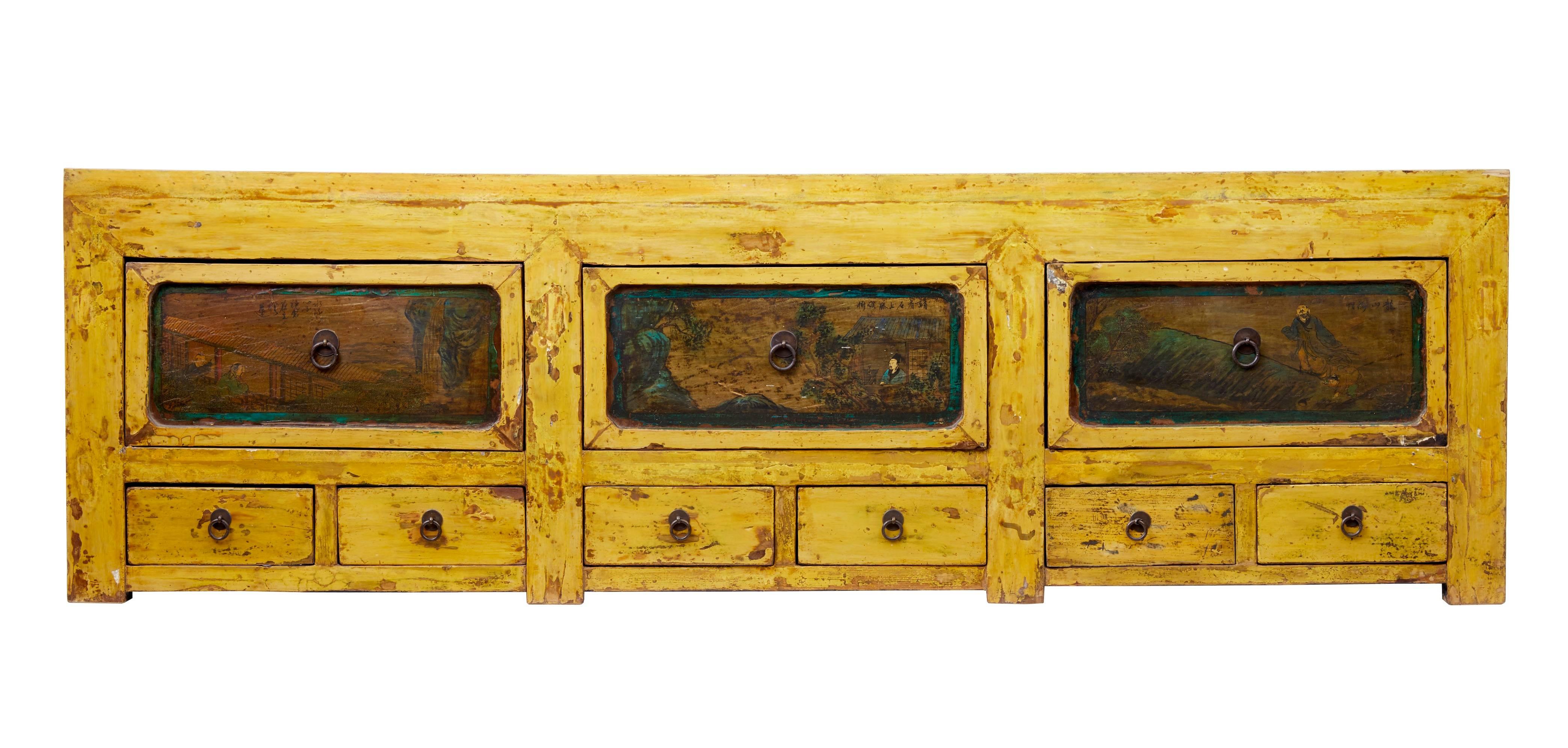 Large Chinese Gansu region sideboard, circa 1850.
Three lots of one deep drawer above two smaller drawers (nine in total)
Large drawers have painted traditional Chinese scenes on them.
Striking yellow lacquer has small losses, there is also a