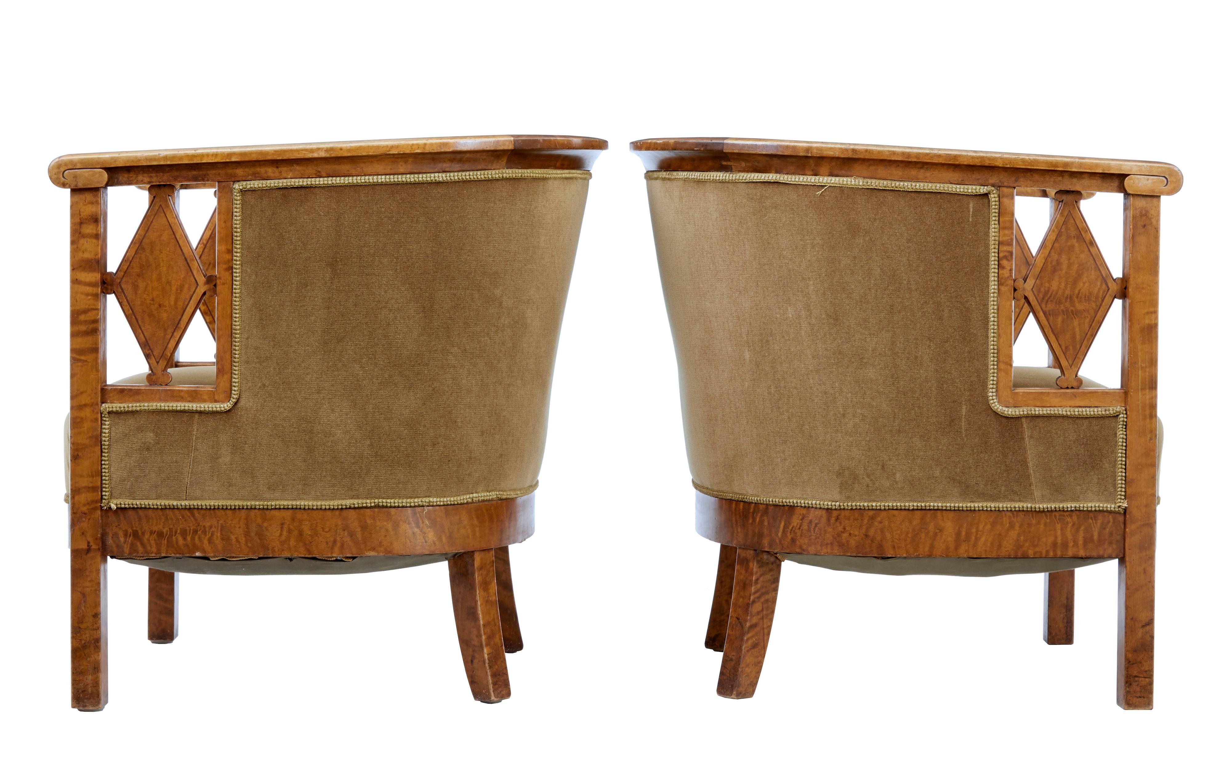 Fine quality pair of Swedish birch bergere armchairs, circa 1920.
Horseshoe shaped backs provide real club comfort.
Open sides with stylized diamond.
Covering with minor marks but in good usable condition.
Minor marks to woodwork.

Measures: