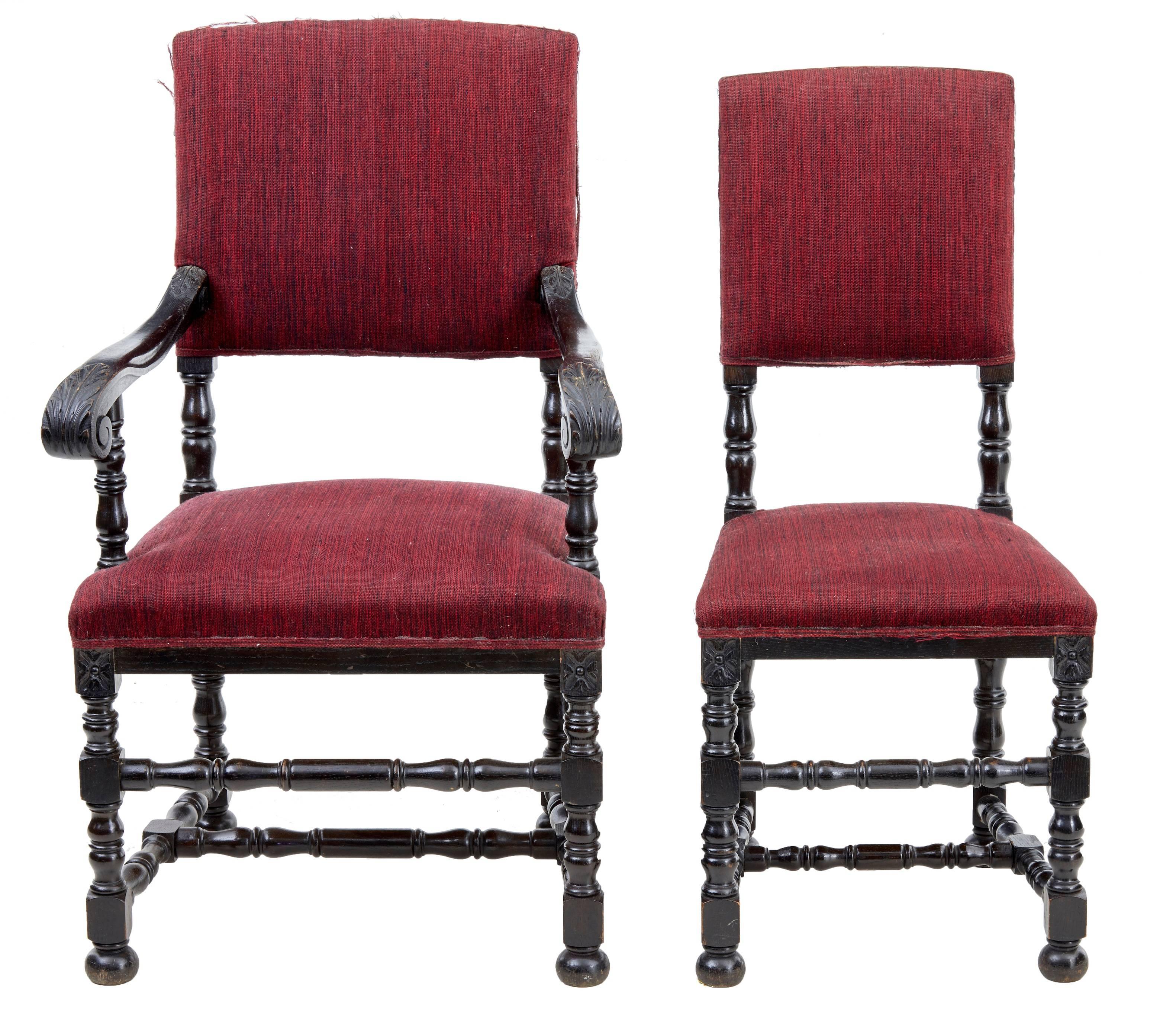 Large set comprising of ten single dining chairs and two carver armchairs.
Stained a very dark oak color.
Standing on turned legs and united by turned stretchers.
Upholstery covering is frayed and lacking beading on some chairs. Ideal for being